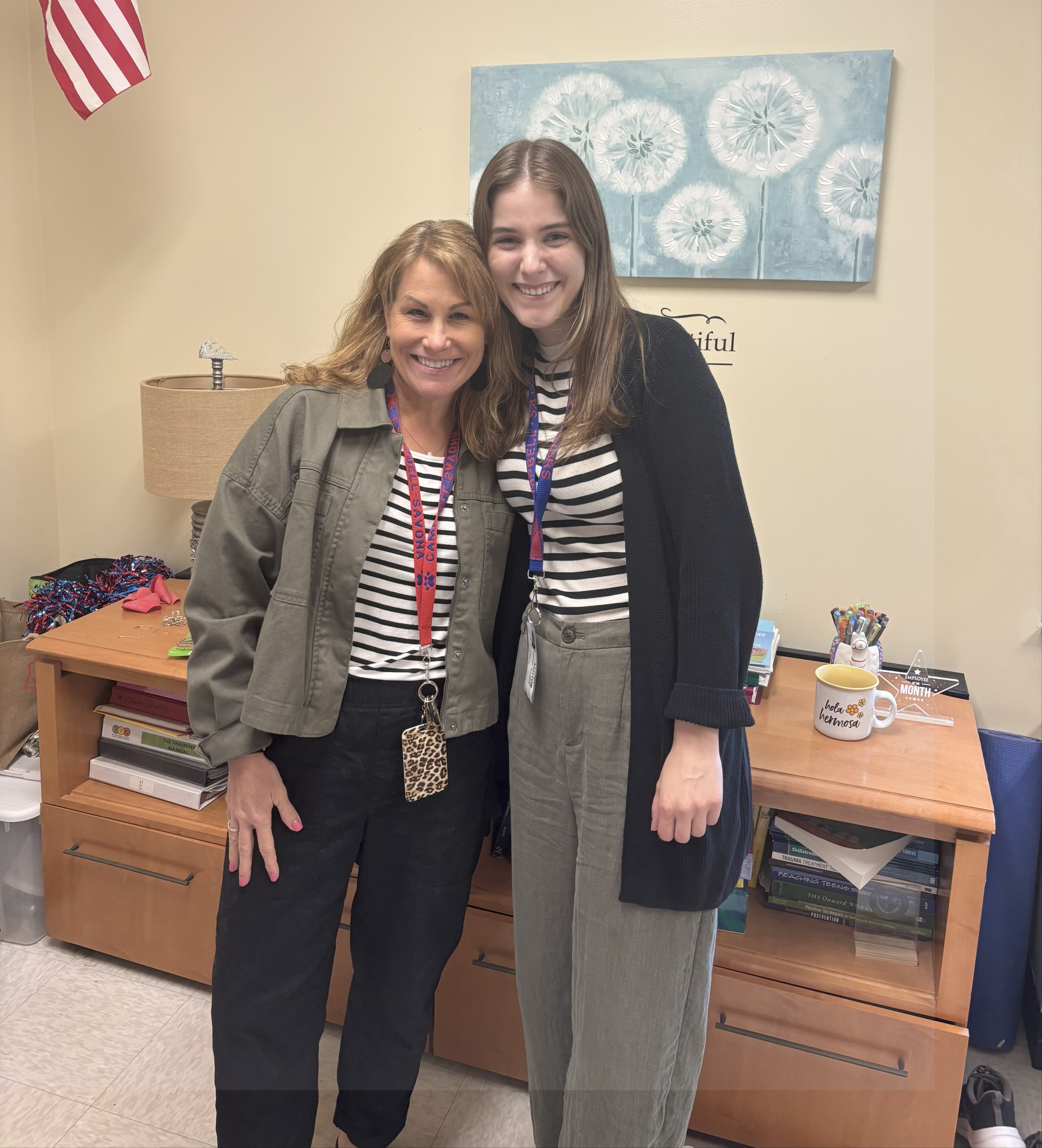 Two guidance counselors smiling in office