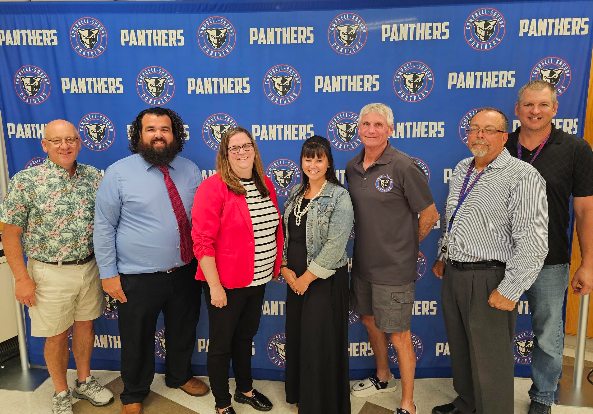 Picture of BOE in front of Panther Backdrop