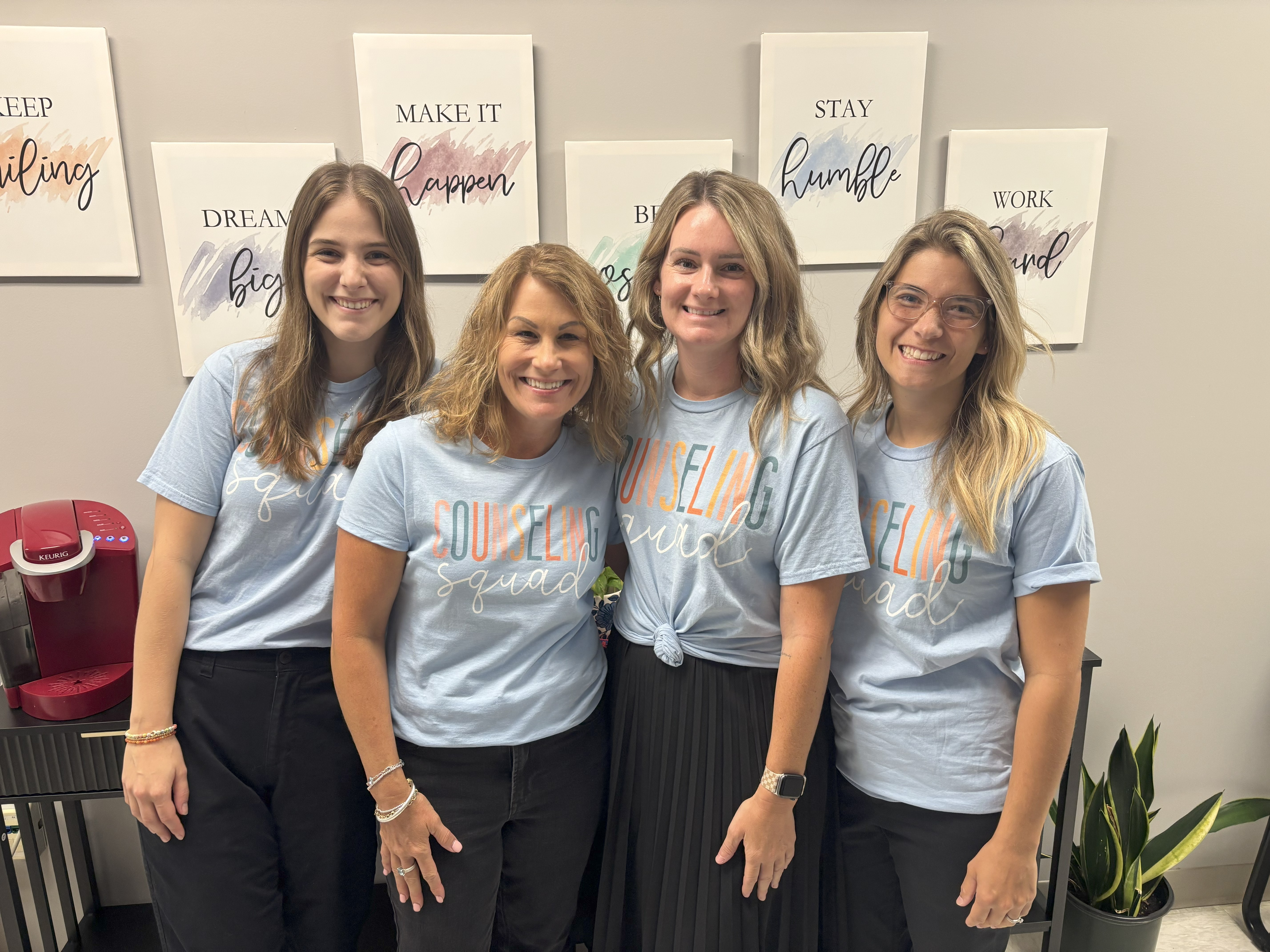 School counselor's posing together