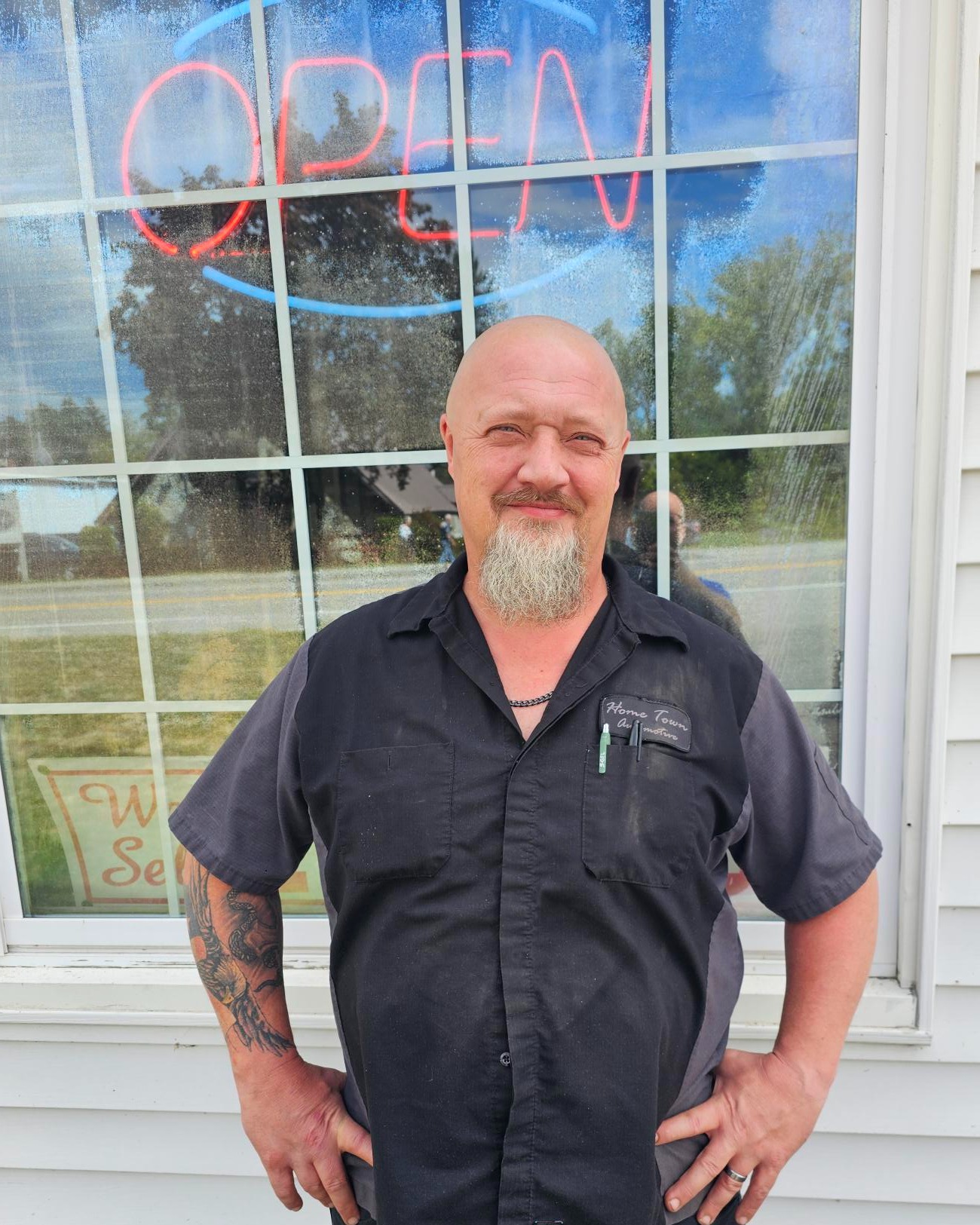 Dave Sith standing in front of his auto repair shop