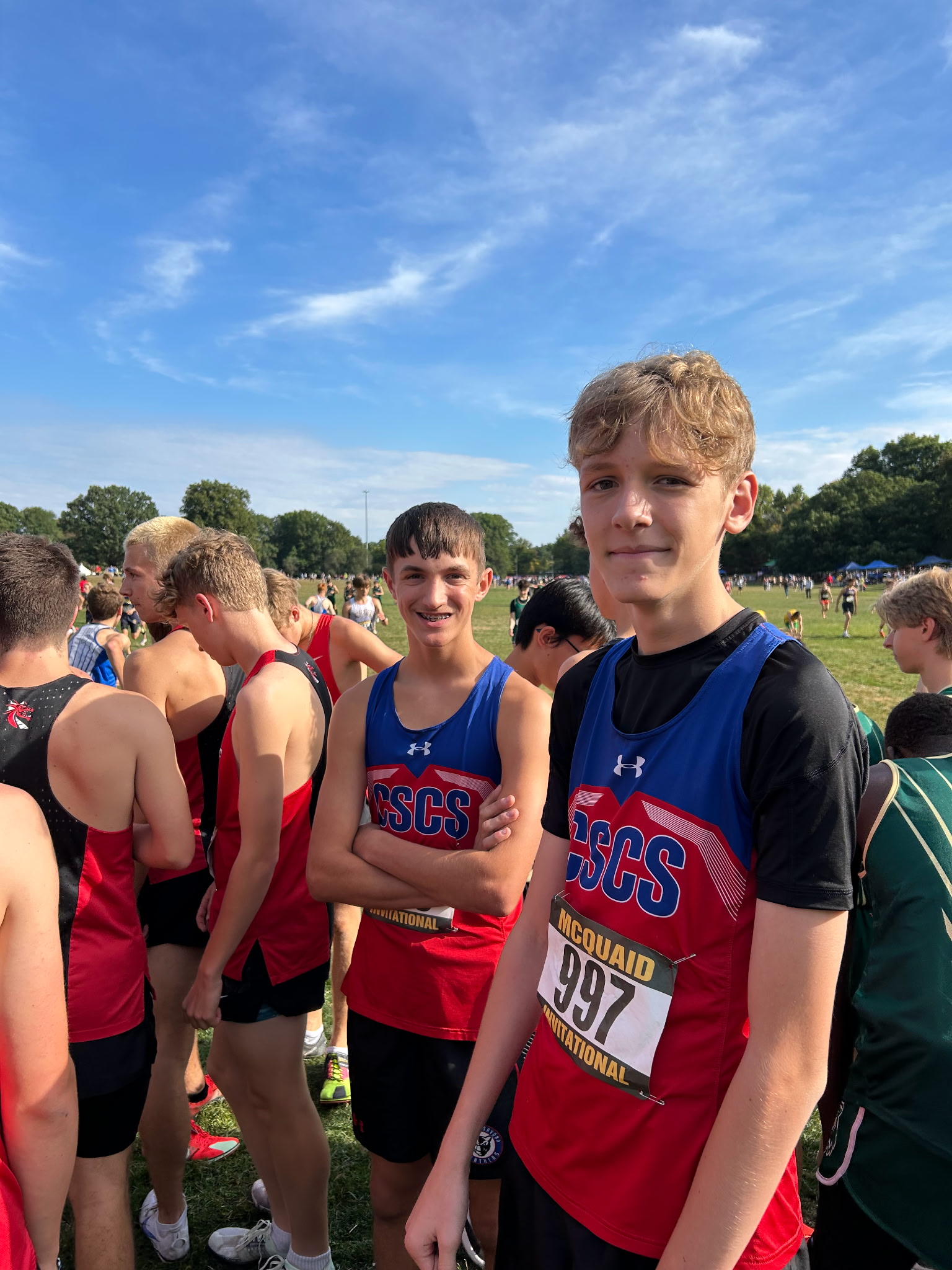 Two cross country runners in uniforms