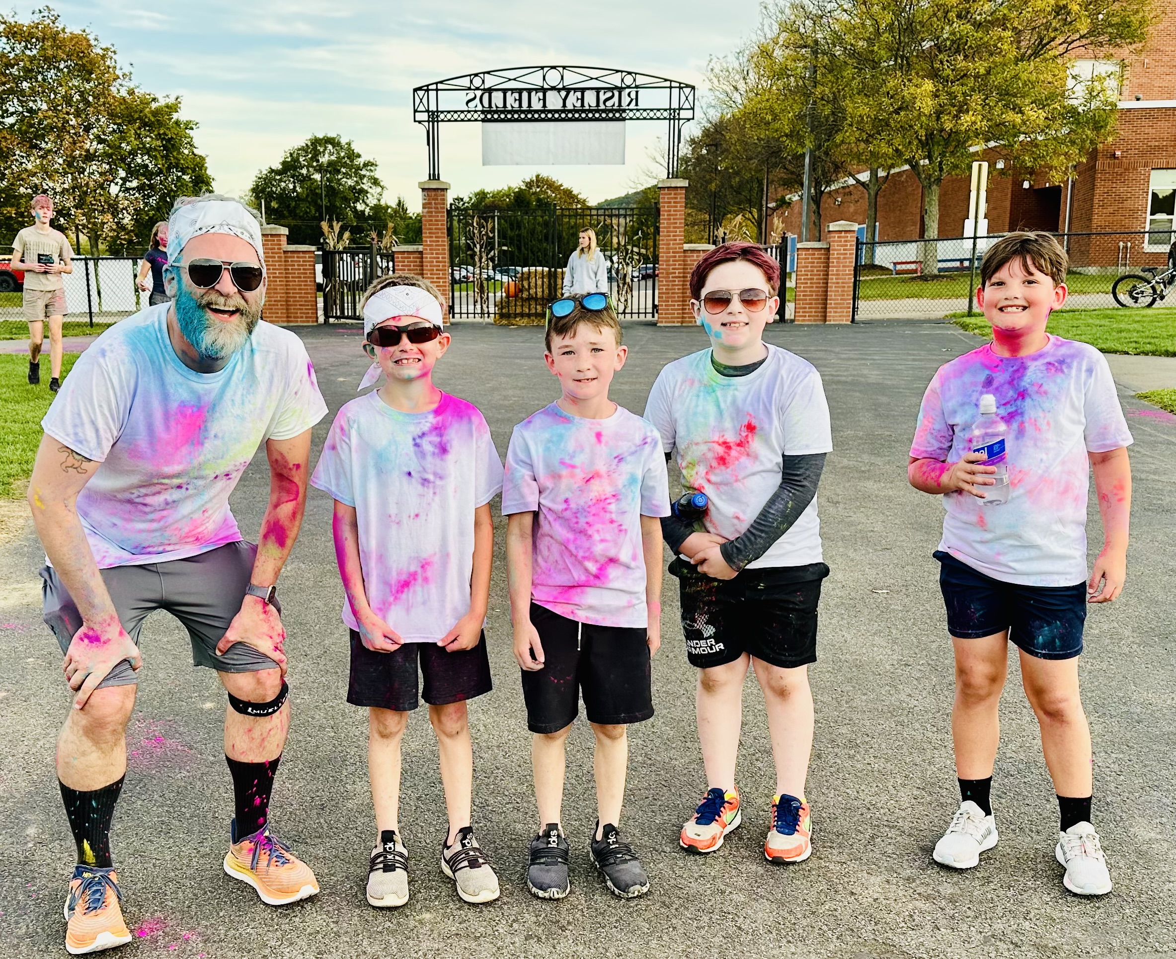 Students with teacher posing after the color run
