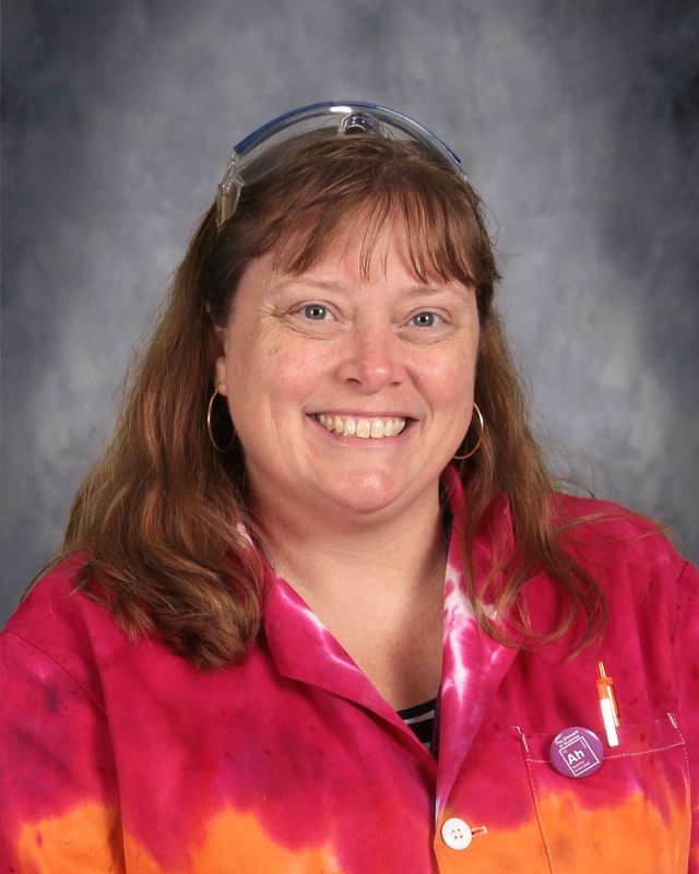 Teacher smiling red shirt