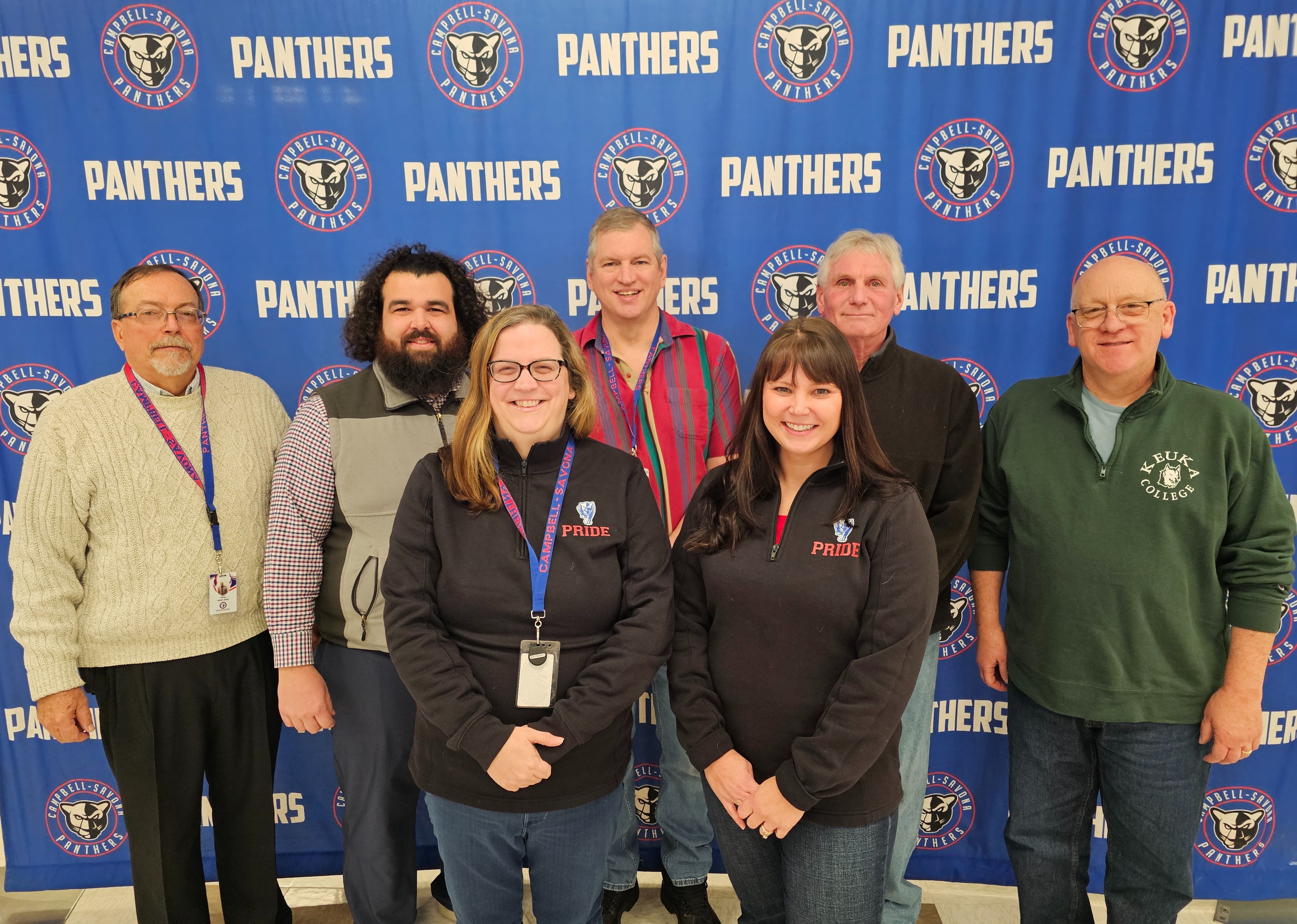 Picture of BOE in front of Panther Backdrop