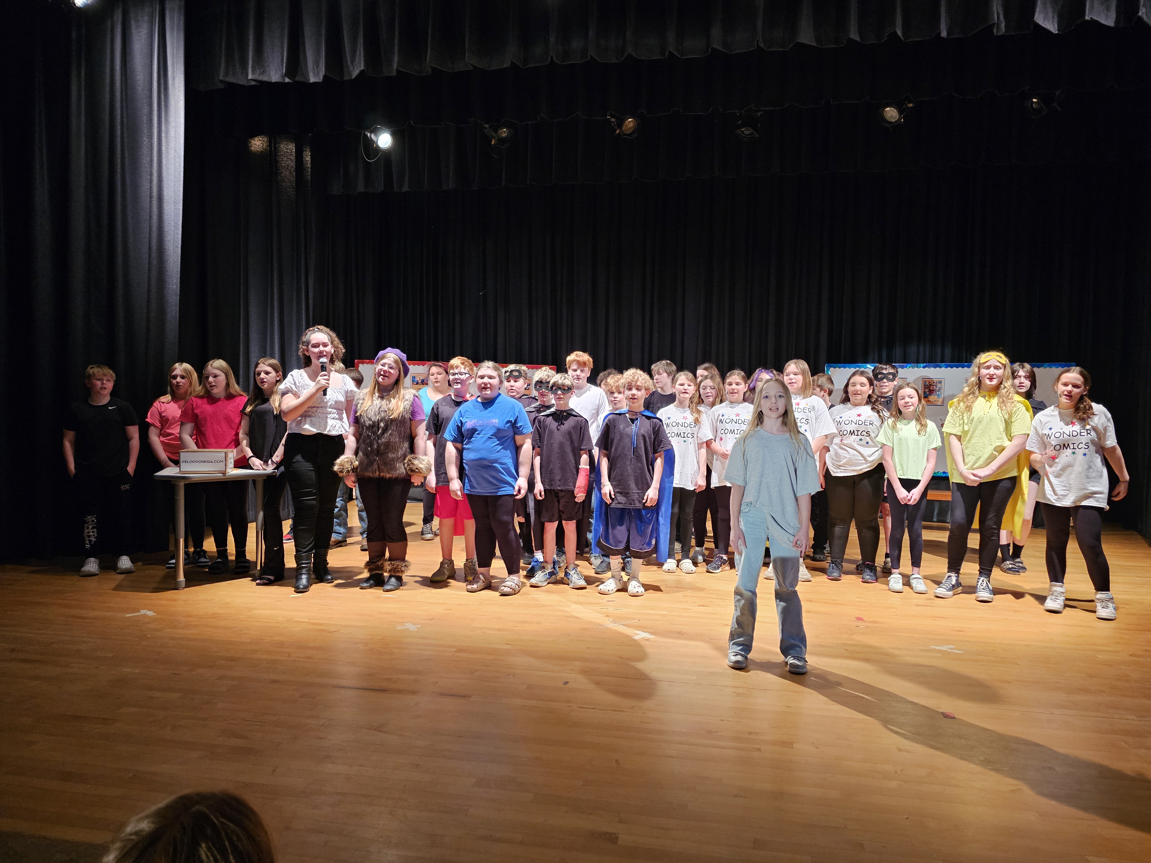 6th grade play students on stage