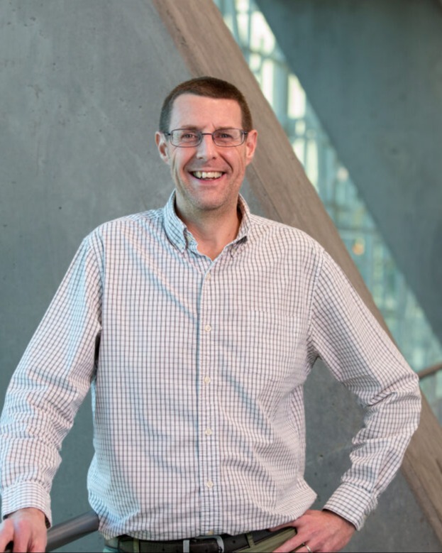 Picture of man with glasses and collared shirt