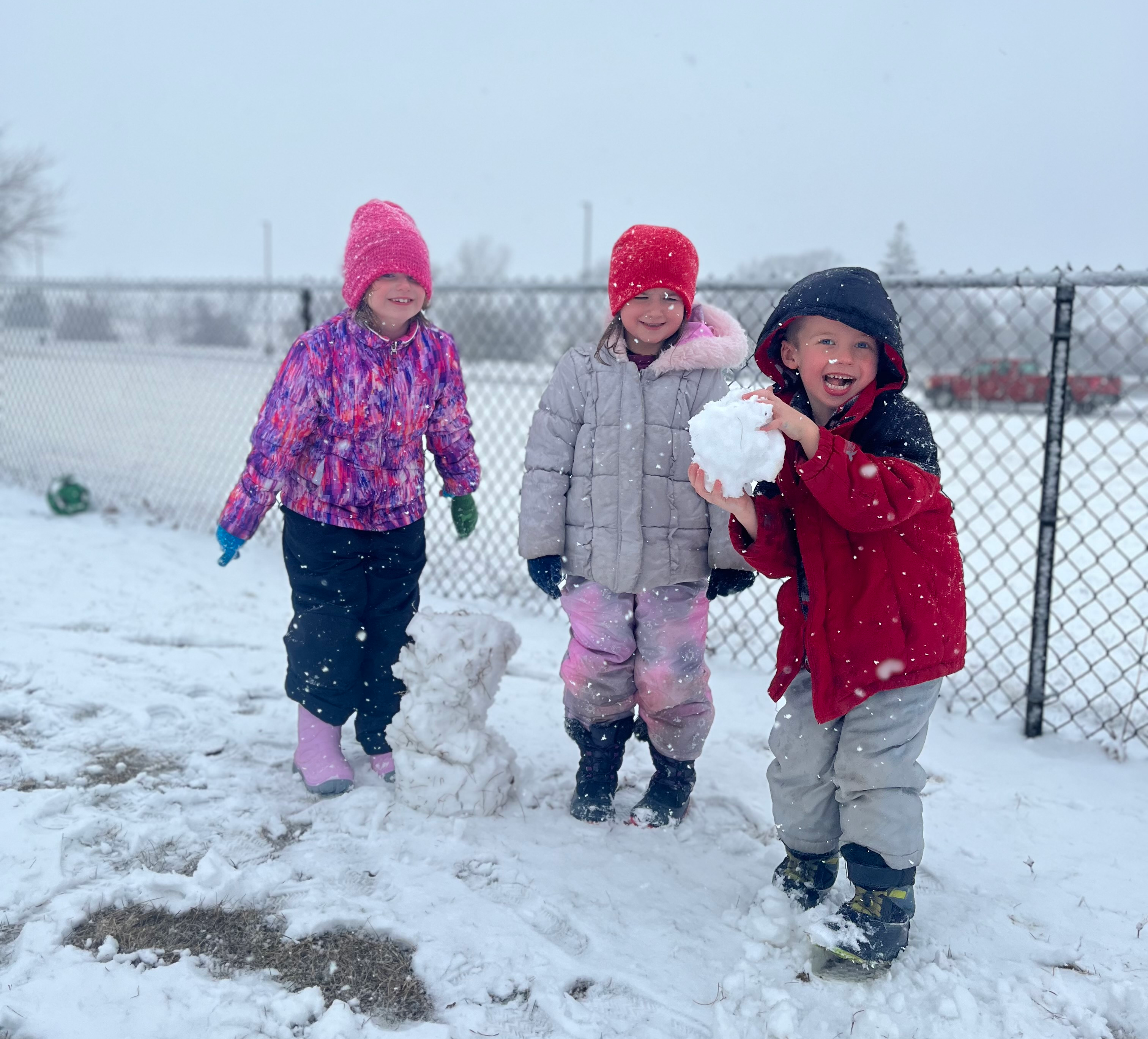 elementary students playing in the snow