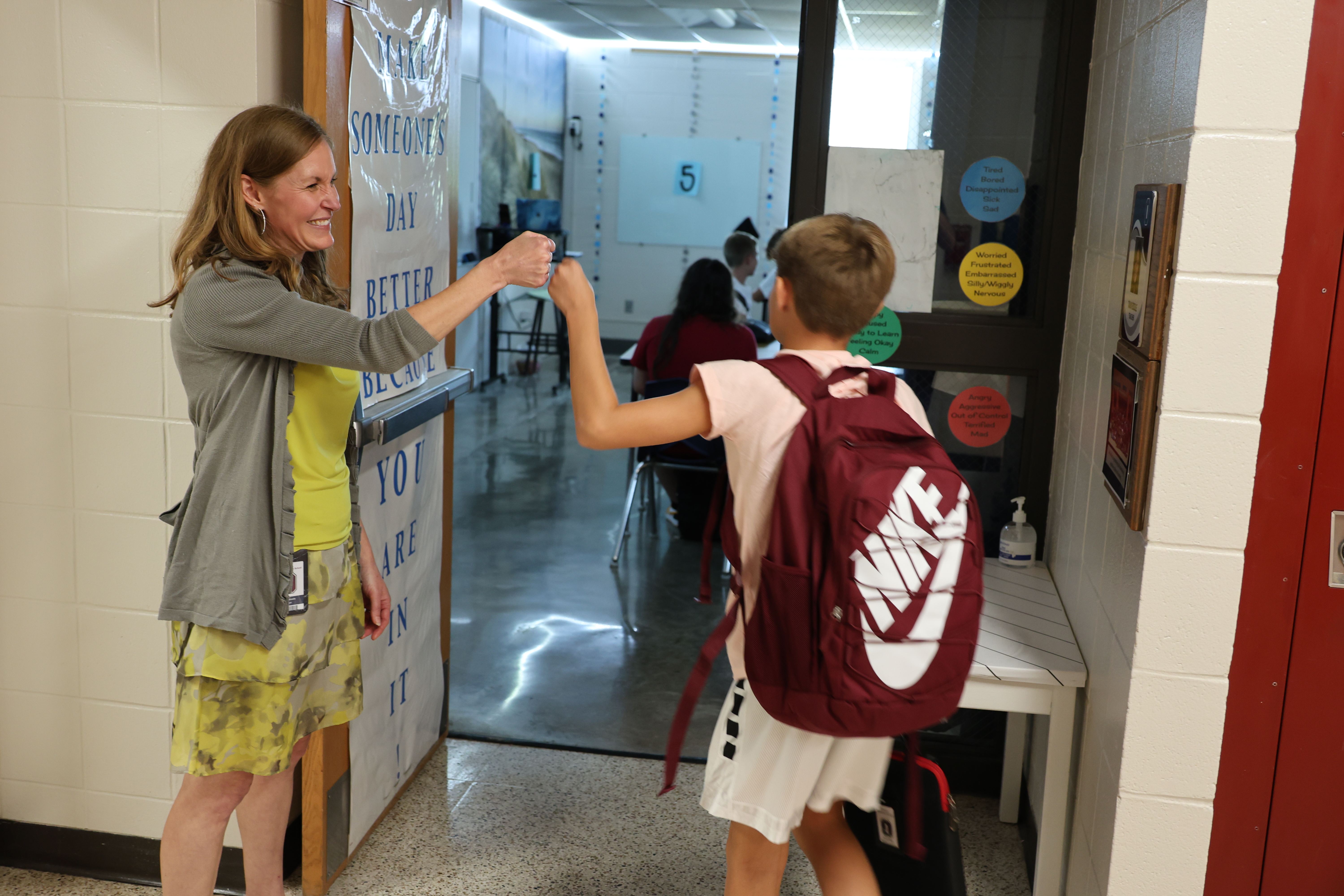 oms student greeted by teacher