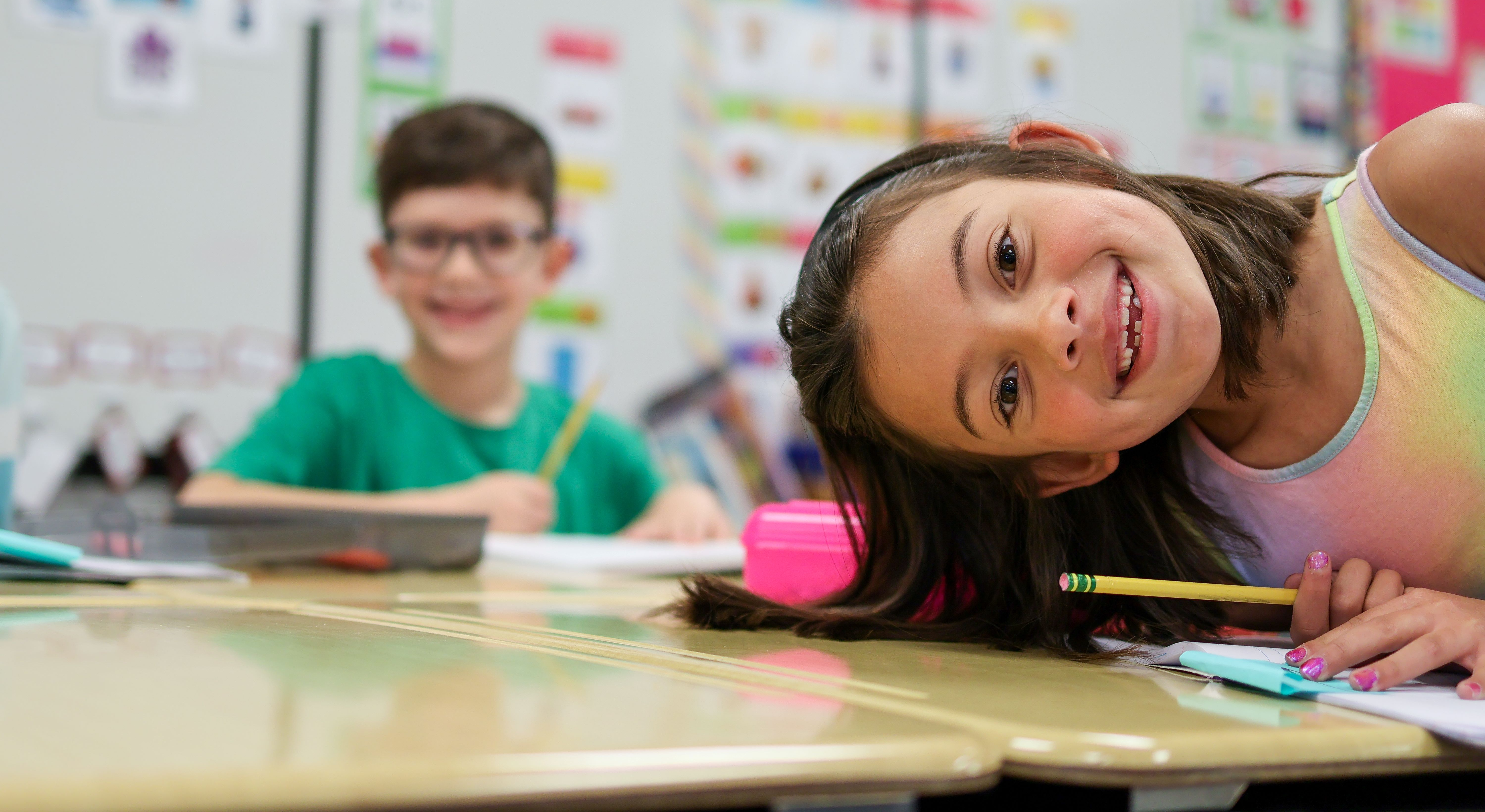 two students smile for the camera