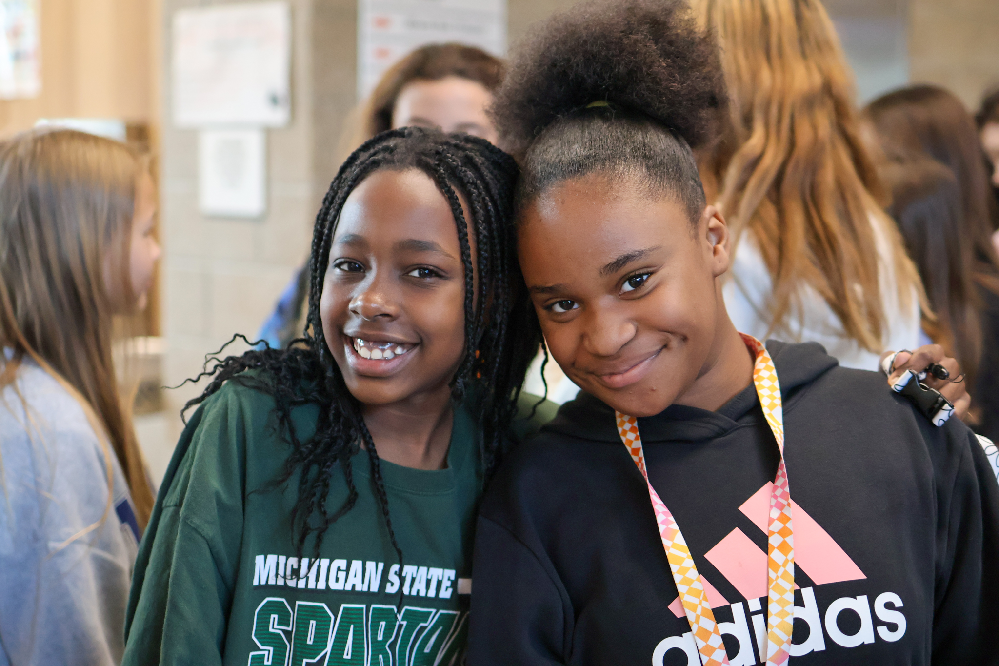 two girls smile for a photo