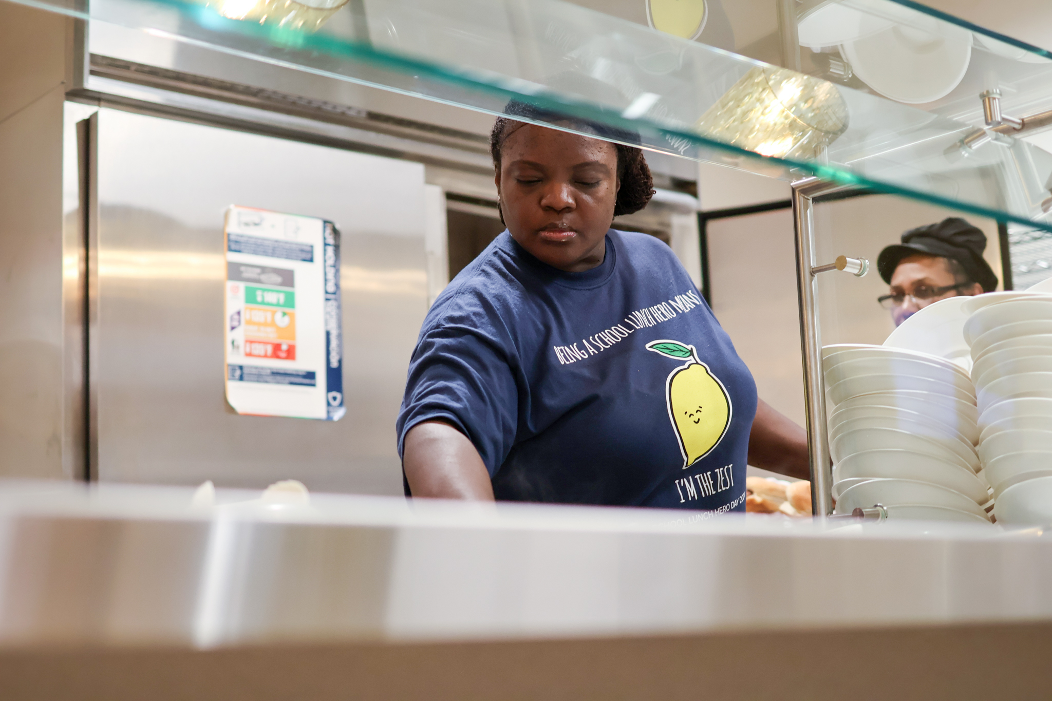 a food service worker behind a servery