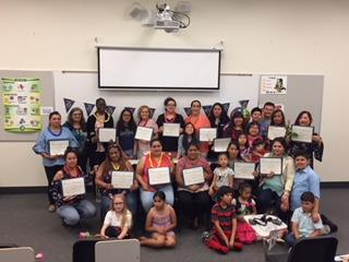 English Learners holding up certificates