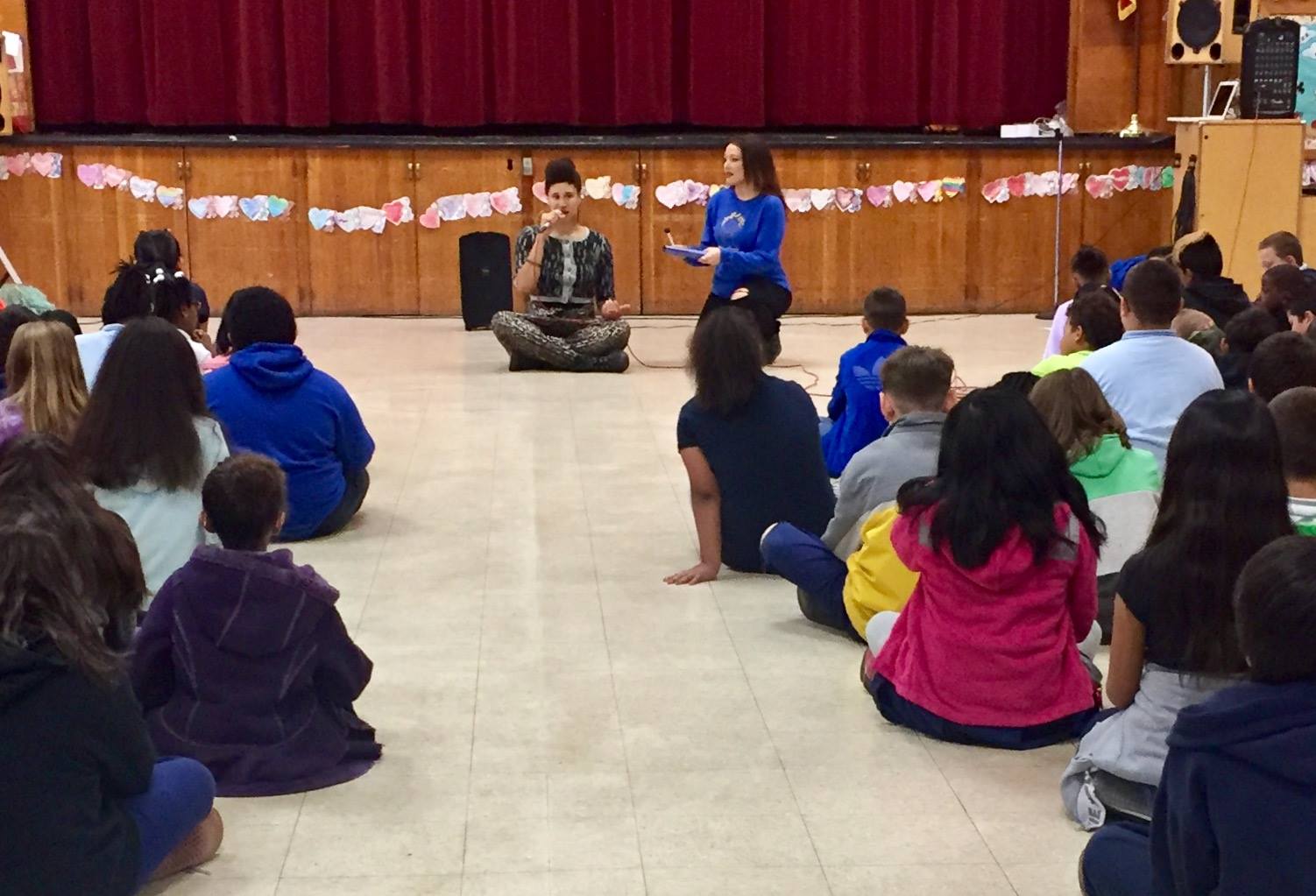 Belshaw students participating in a mindfulness assembly