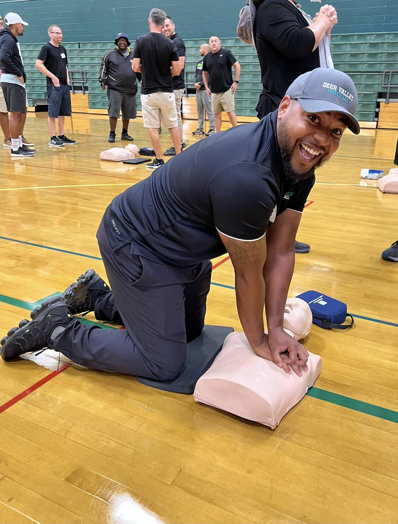 Coach engaged in CPR training