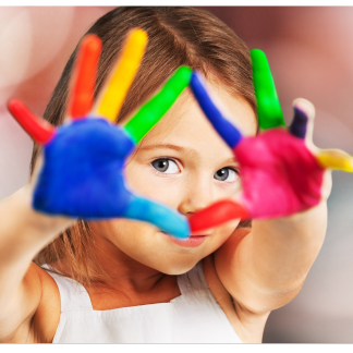 Student with multi colored painted hands