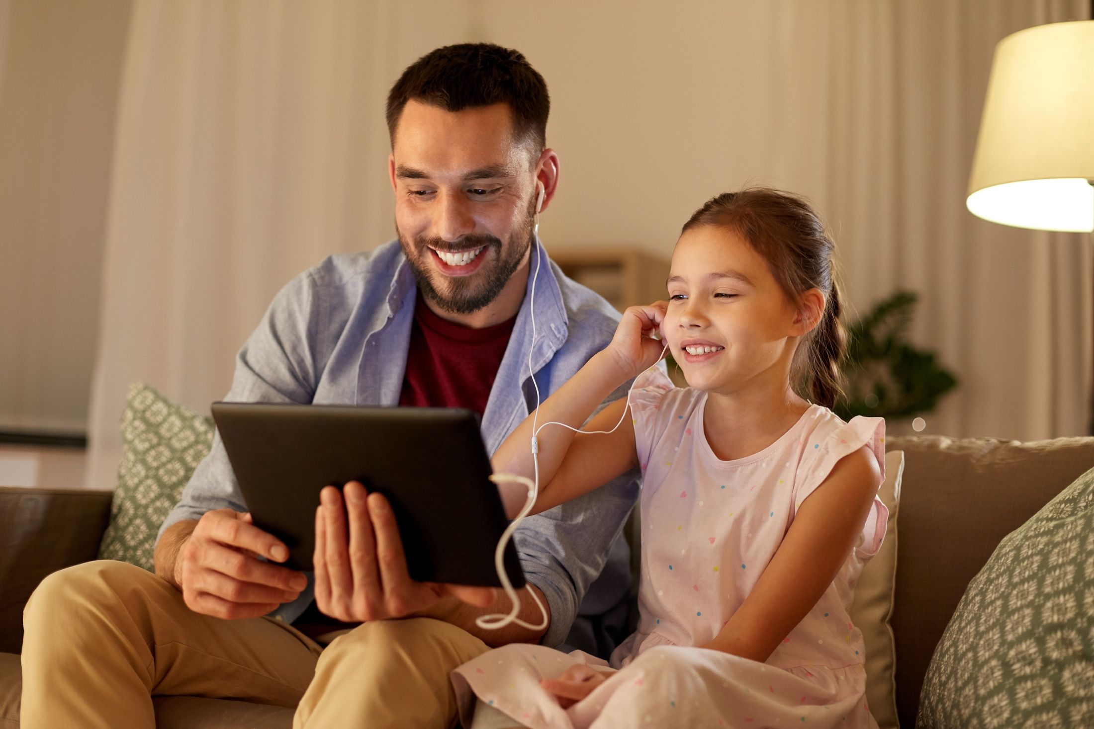 Parent and child sharing a tablet