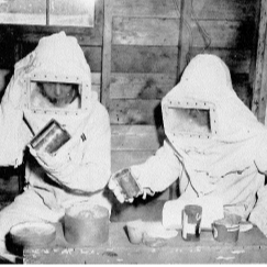 two people sitting with white suits on