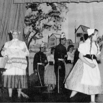 people dressed up acting in a play