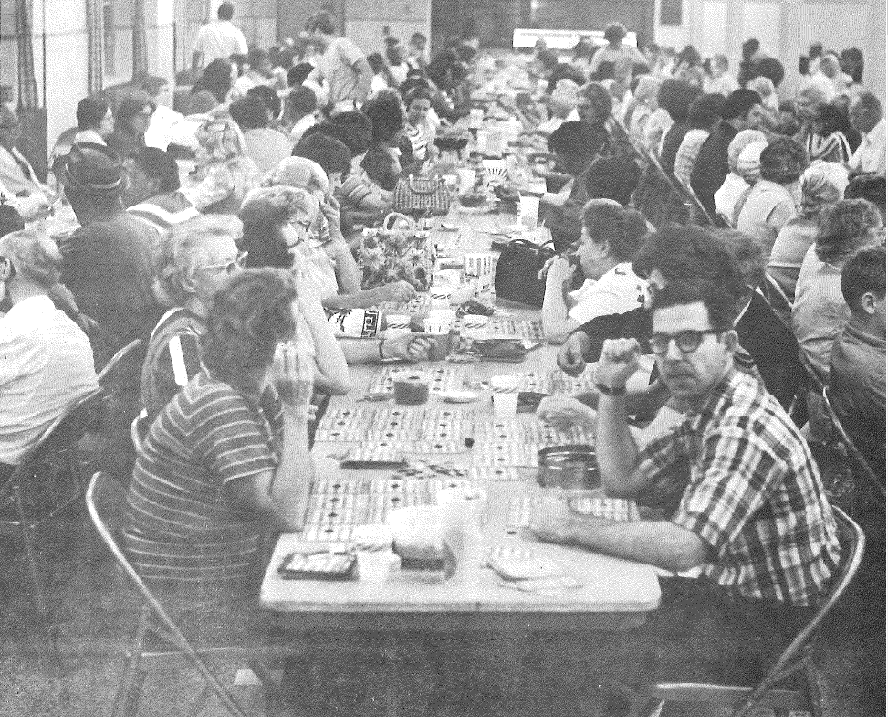 people sitting at a table playing bingo