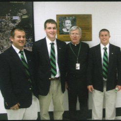 Father Zettel and four student standing and smiling