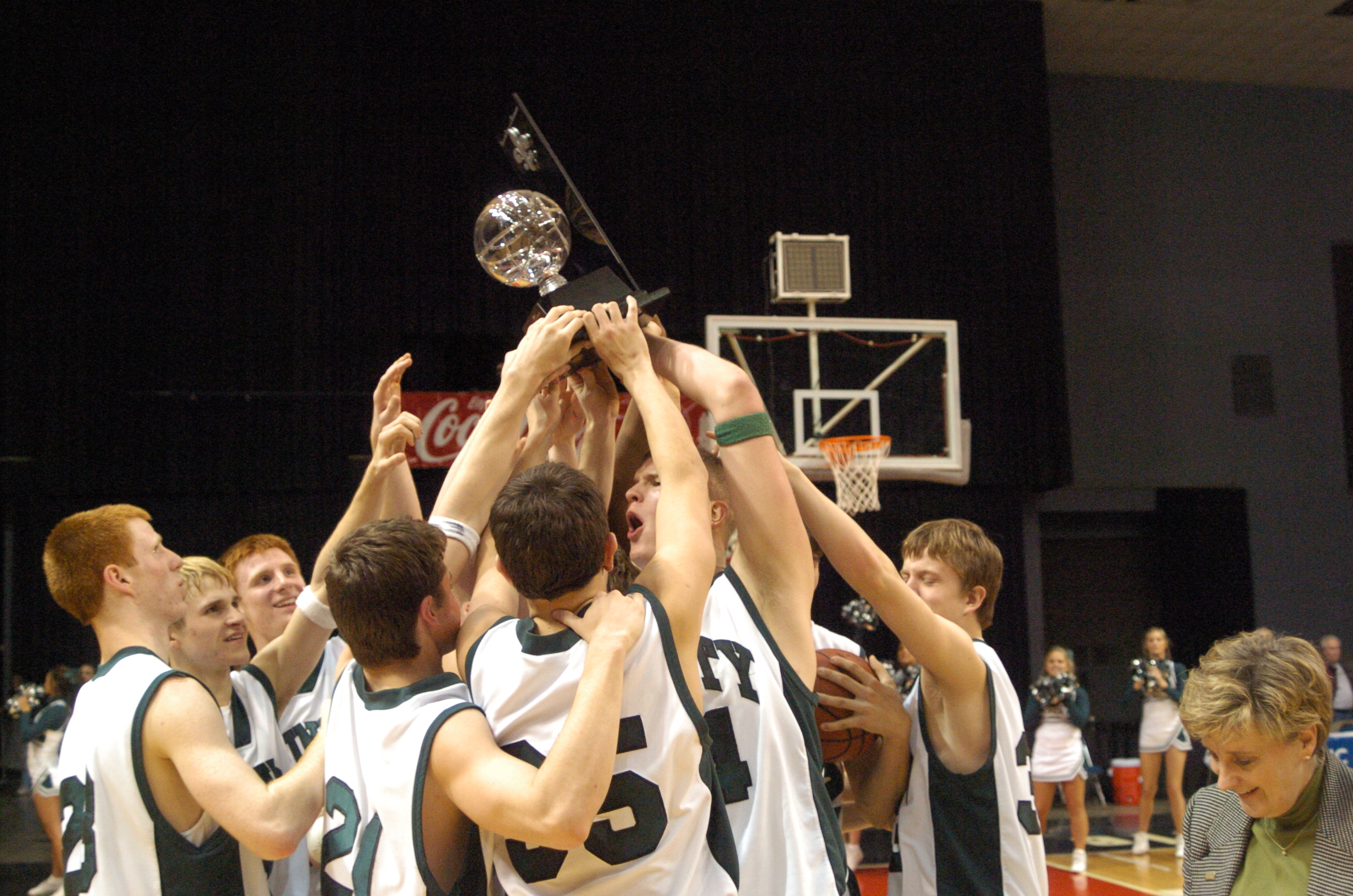 basketball team holding the trophy