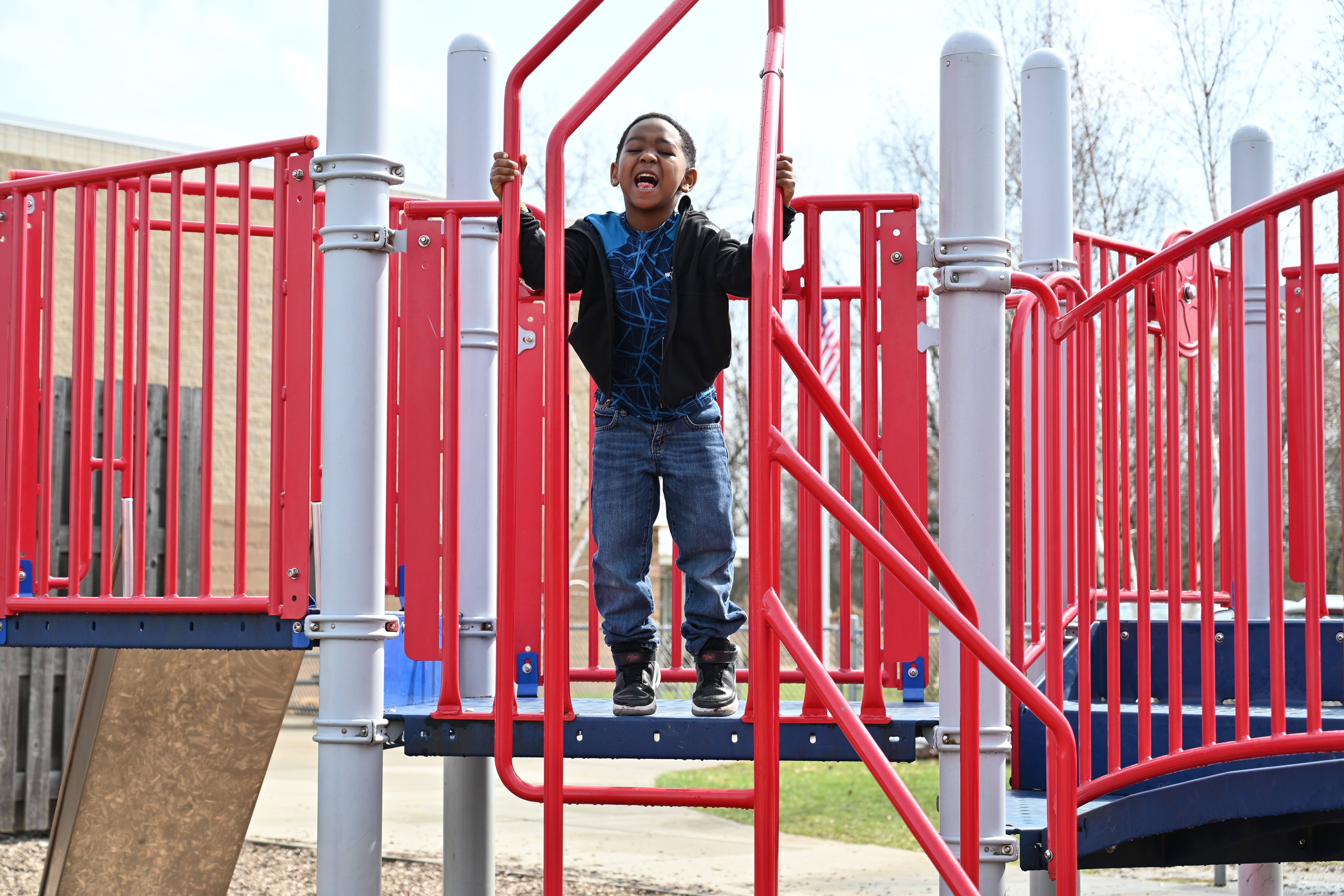 male student on the playground playing 