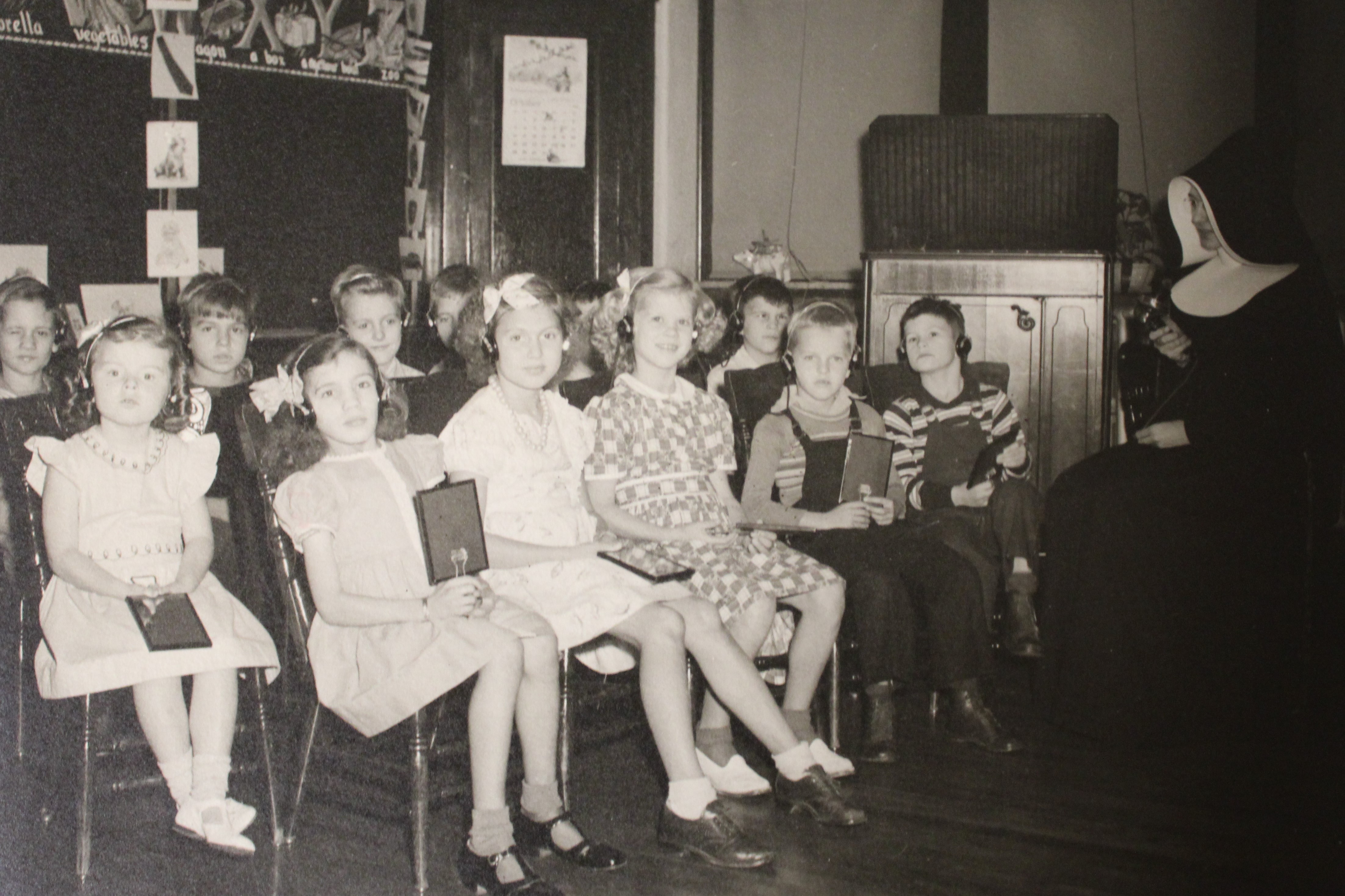 Children sitting in a class room. 