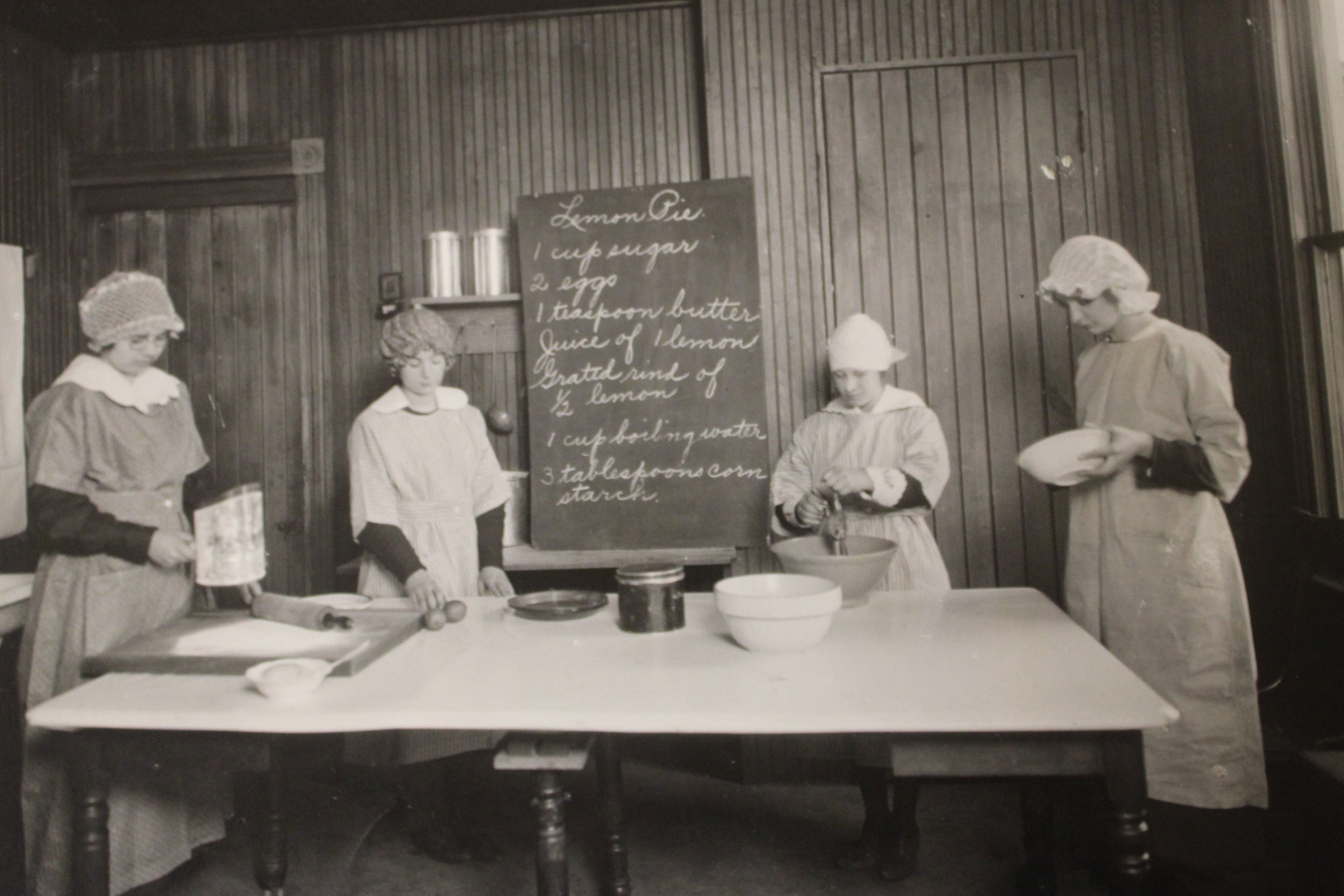 Photo of women cooking together. 