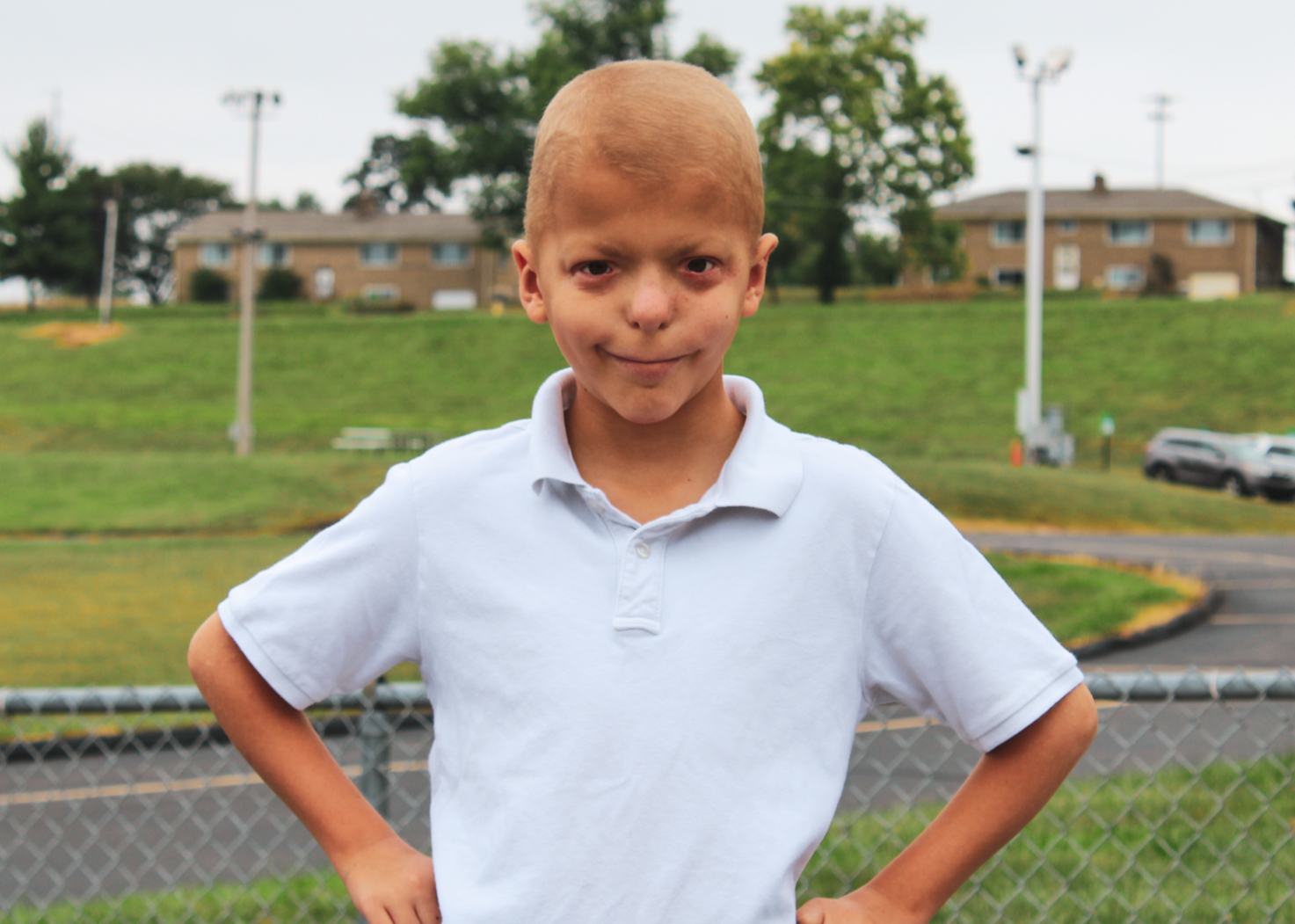 a child smiling at the playground