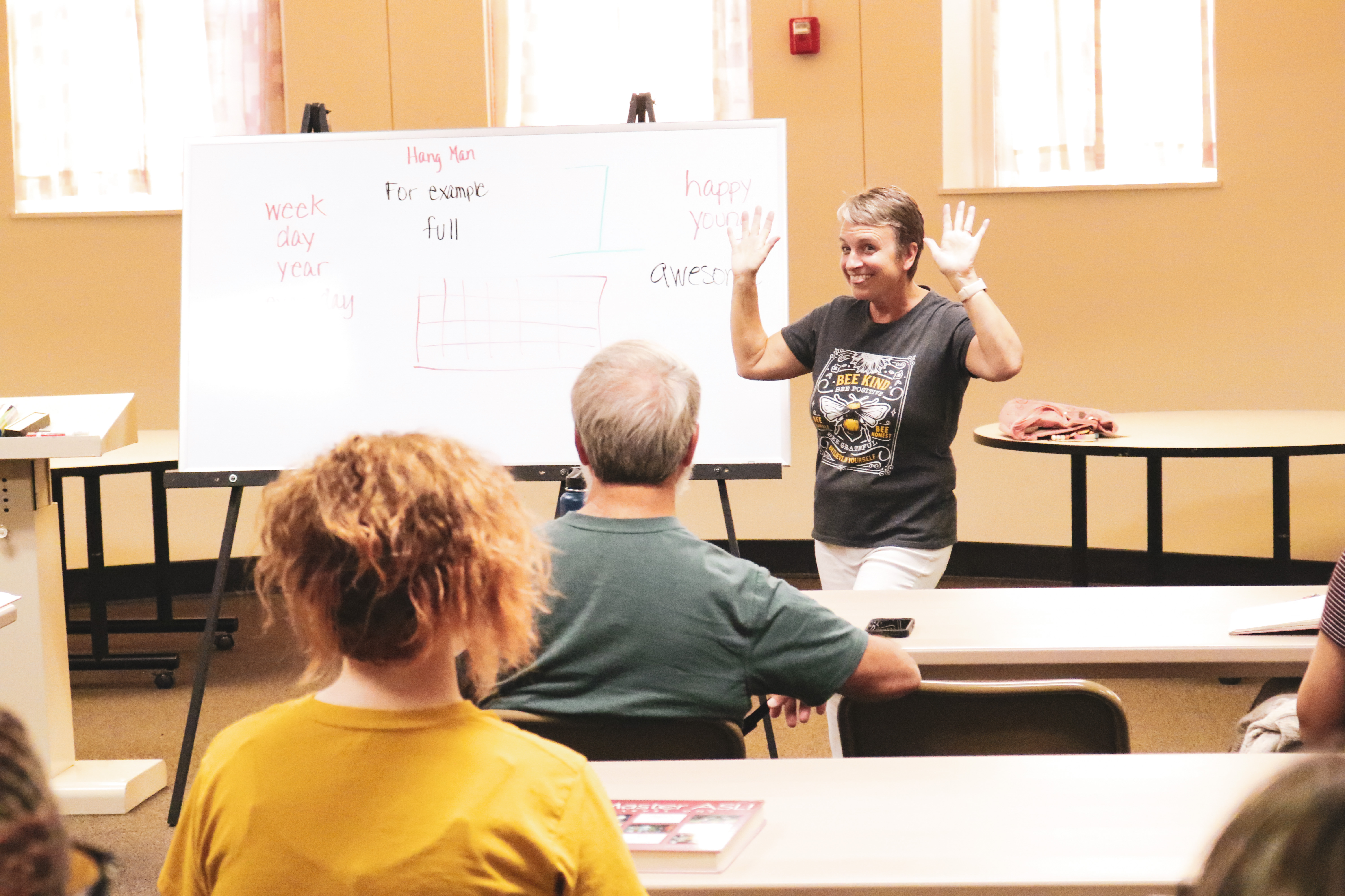 a instructor smiling for ASL class.