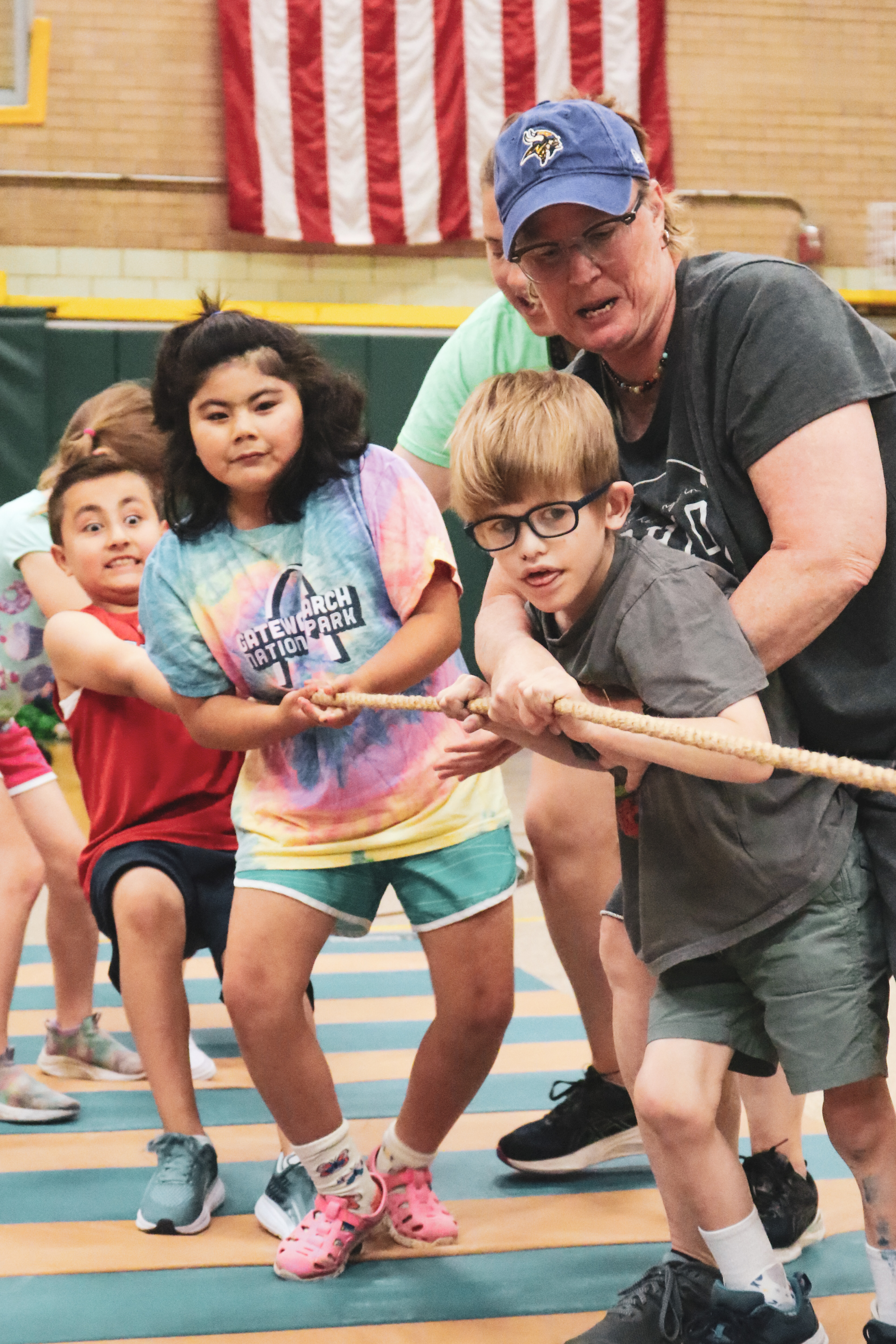 students and staff playing tug of war