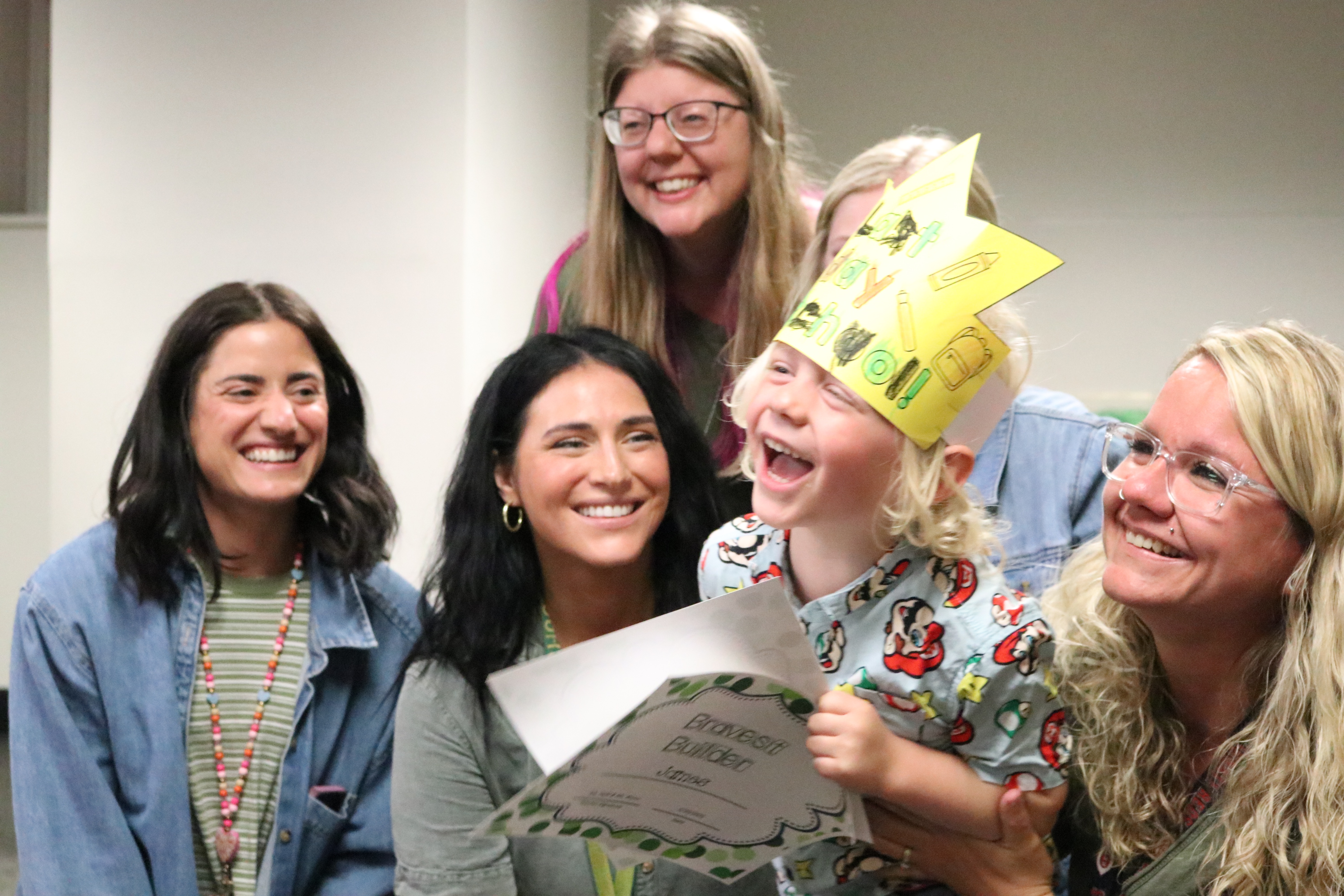 preschool boy student with teachers