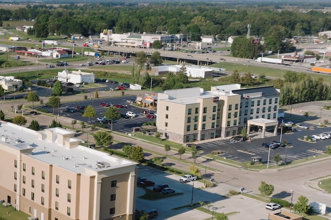 ariel view of hotels, restaurants, and interstate