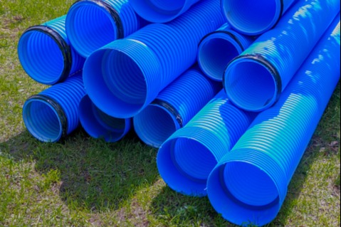 picture of several blue drainage pipes