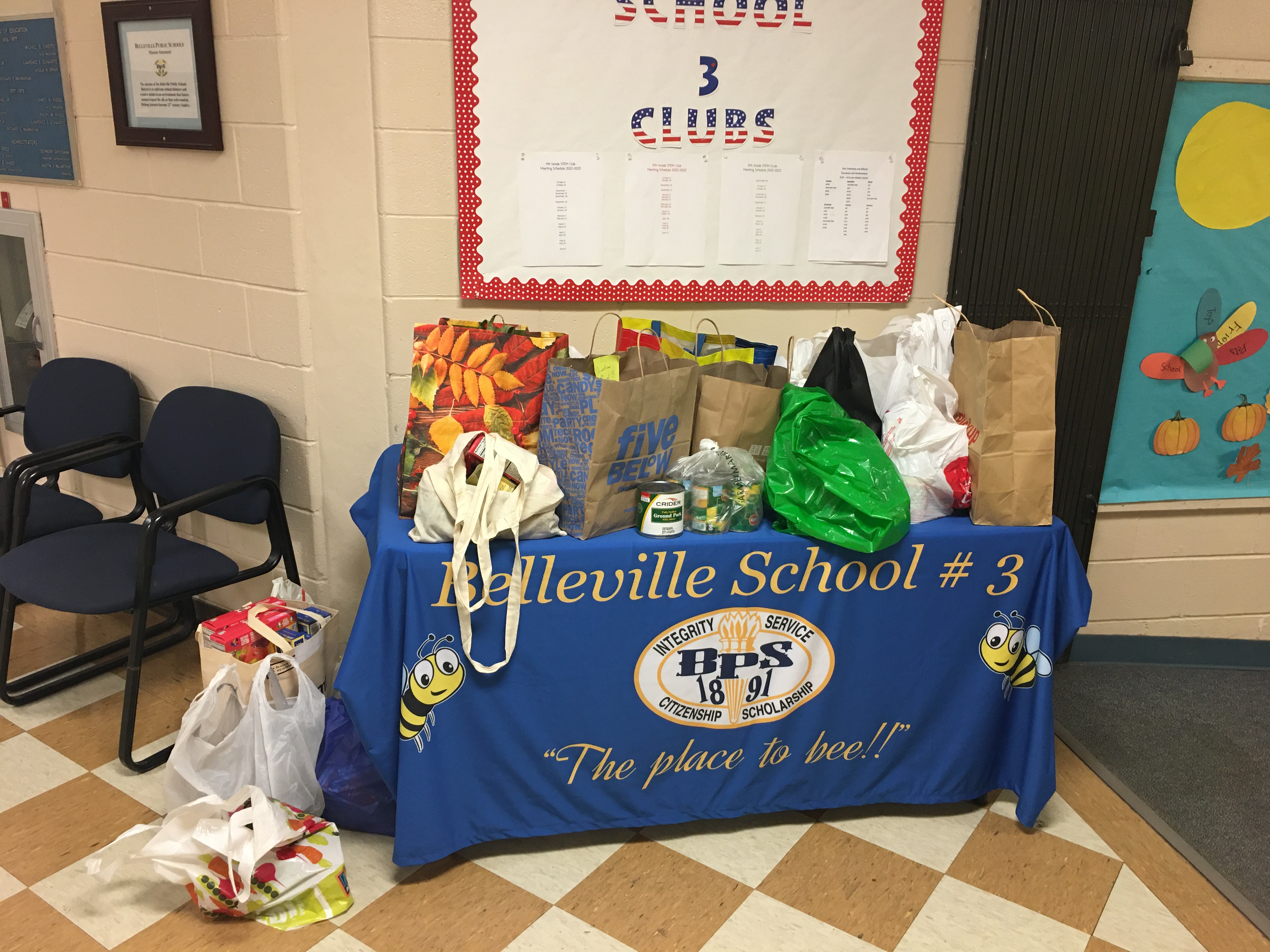 a table laden with student donations to the food pantry