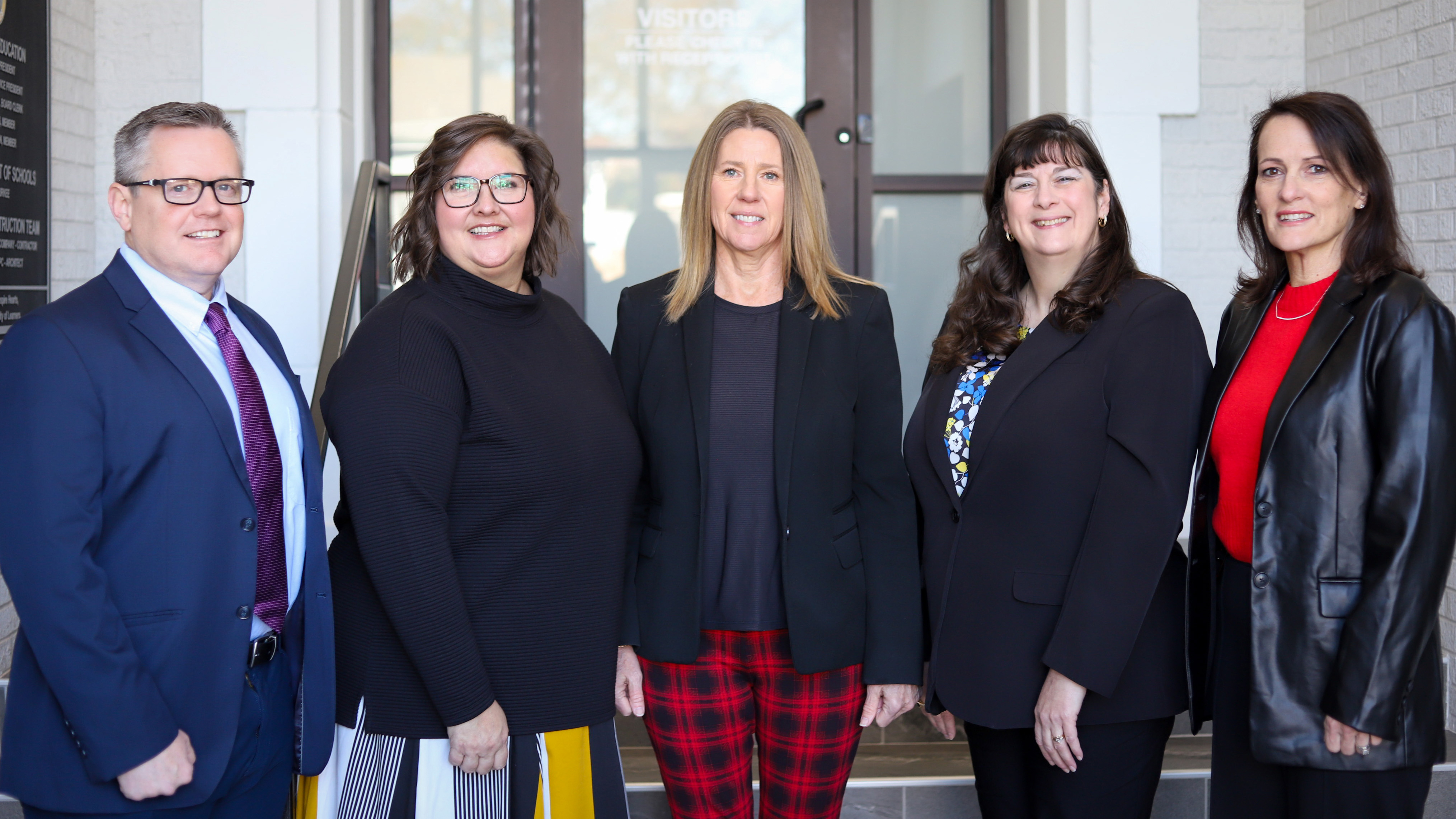 Superintendent's cabinet smiling and facing the camera. From left to right: Shawn Beard, Carrie Schlehuber, Sherry Durkee, Kristie Newby, and Kristin Arnold