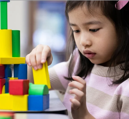 Early Childhood student playing with blocks