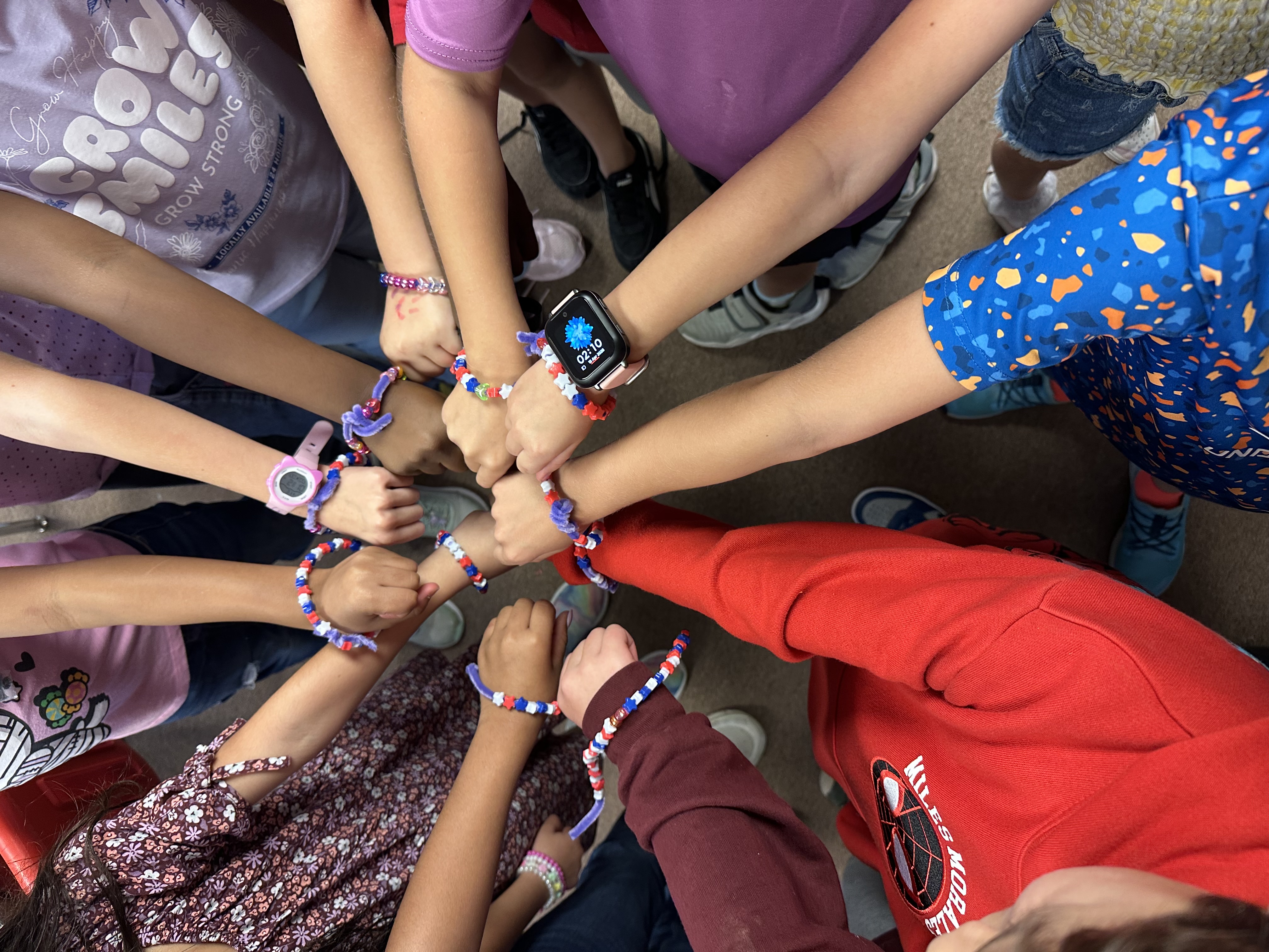 student hands during purple up