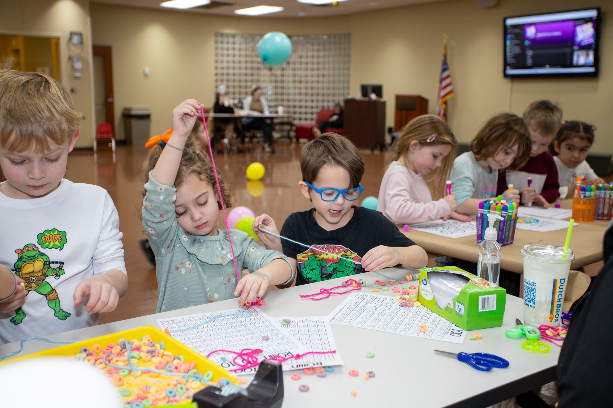 Pre-K Students crafting with yarn