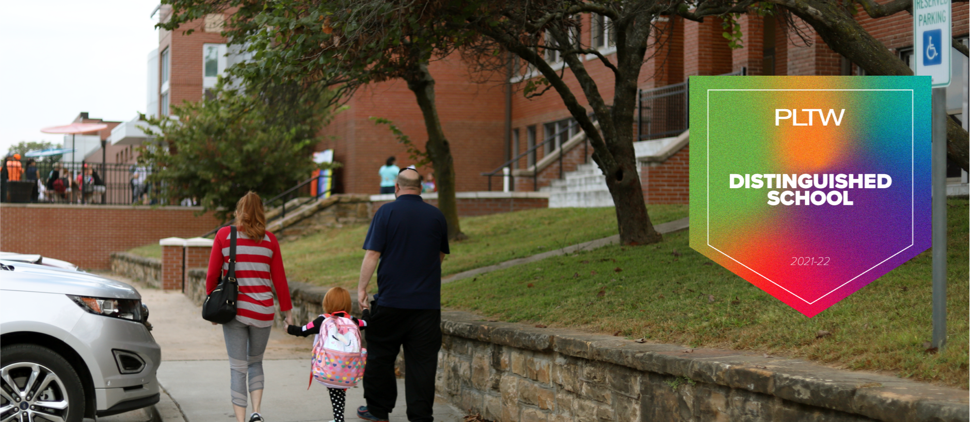 Parents walking child to Garfield STEAM academy