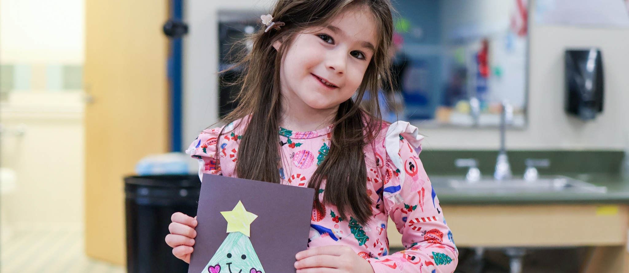 students holding a colorful tarp