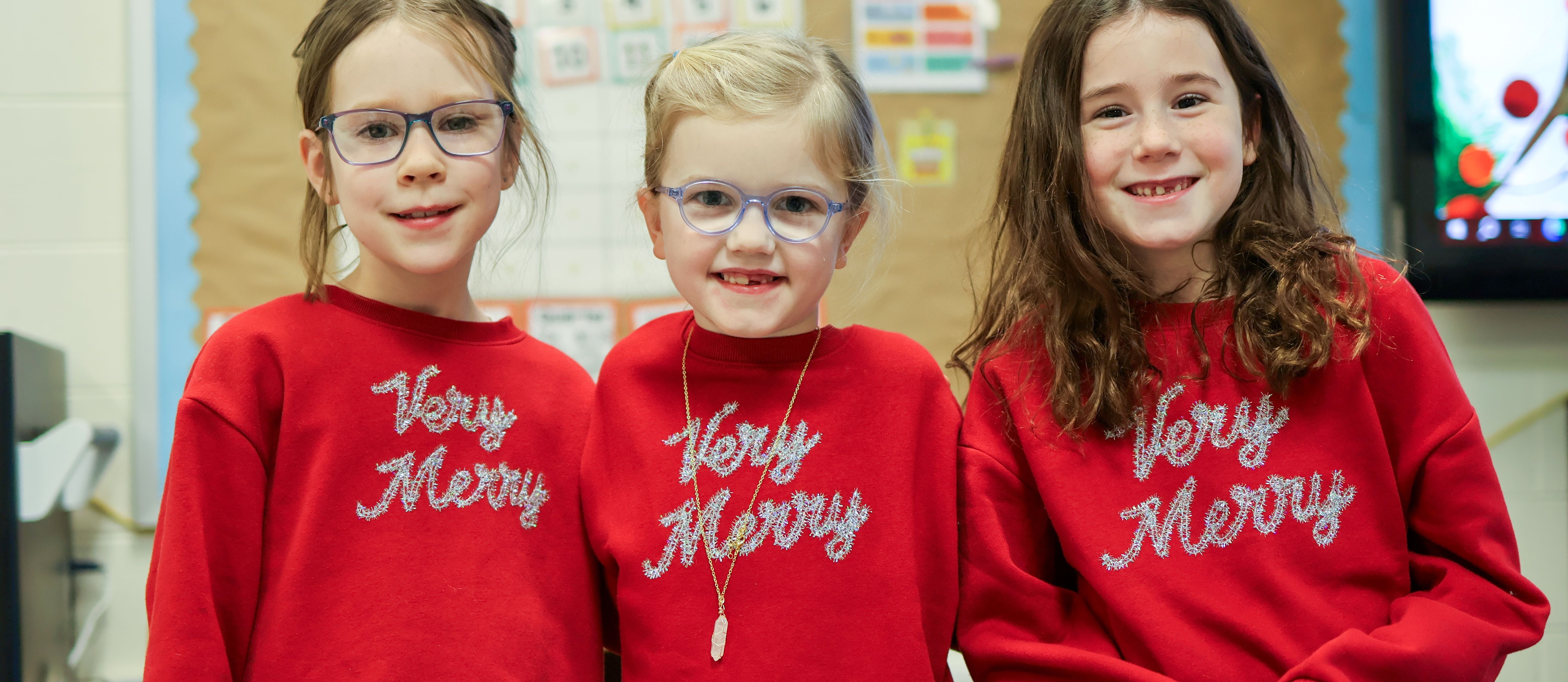 three girls pose for a photo
