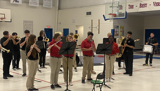 students practicing wind instruments in the gym