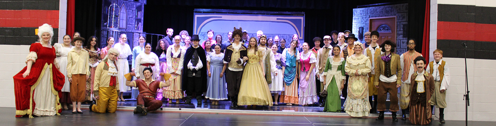 students in brightly colored costumes for a school production