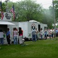 people standing in line to order from food trucks