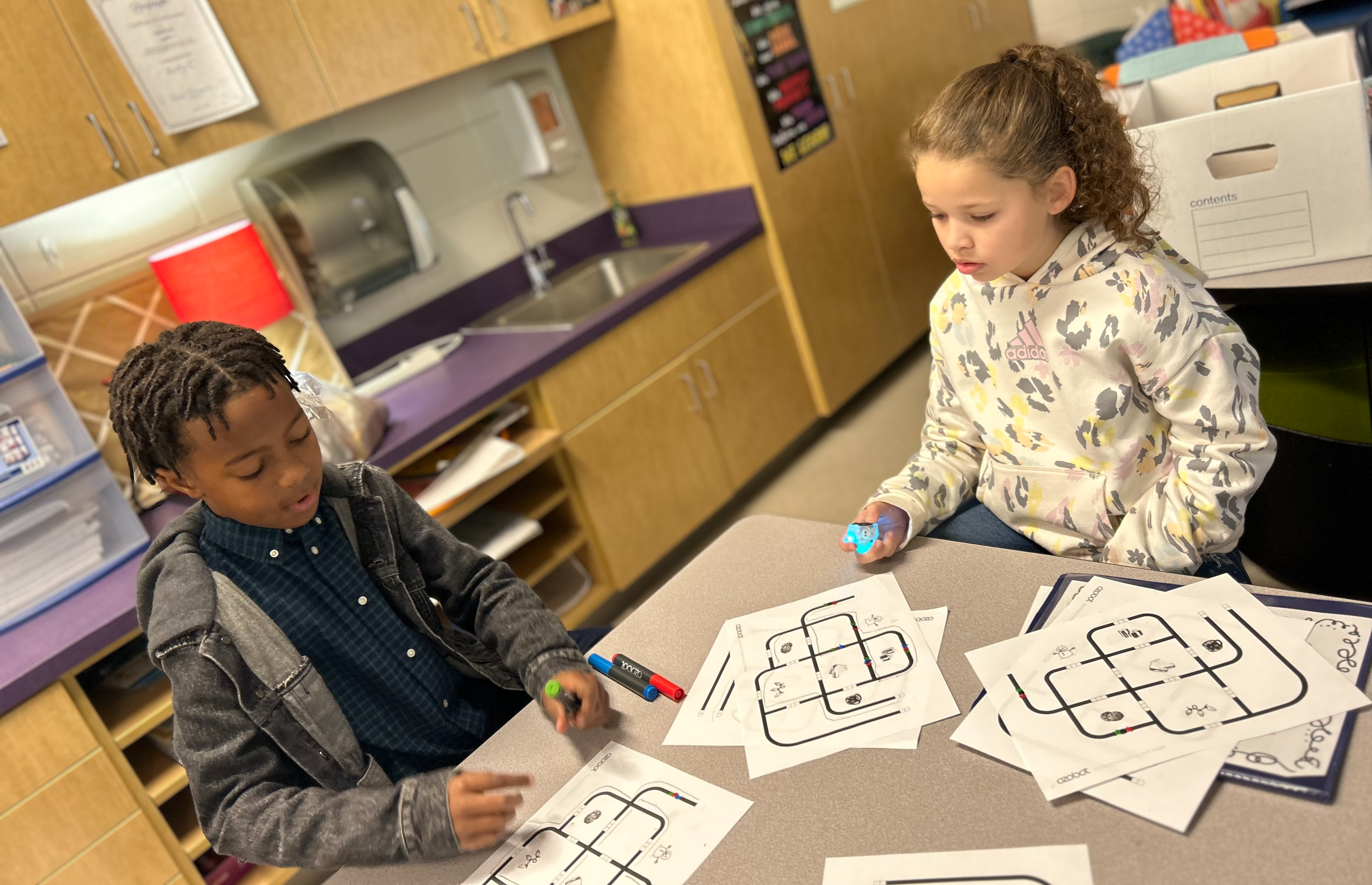 Students coding robots. 