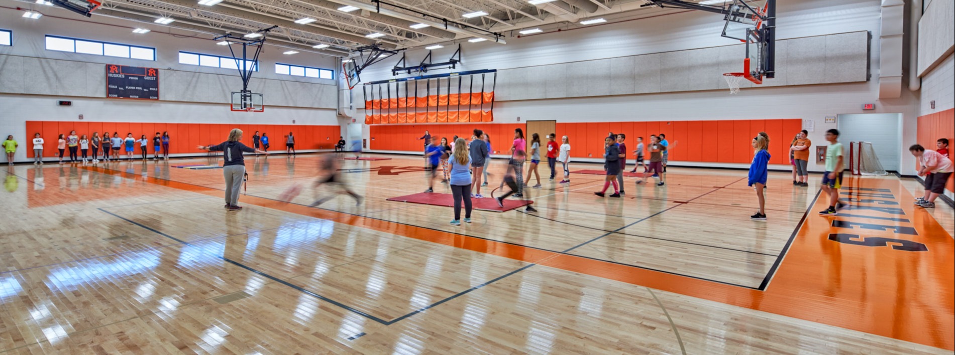 students play in a gym