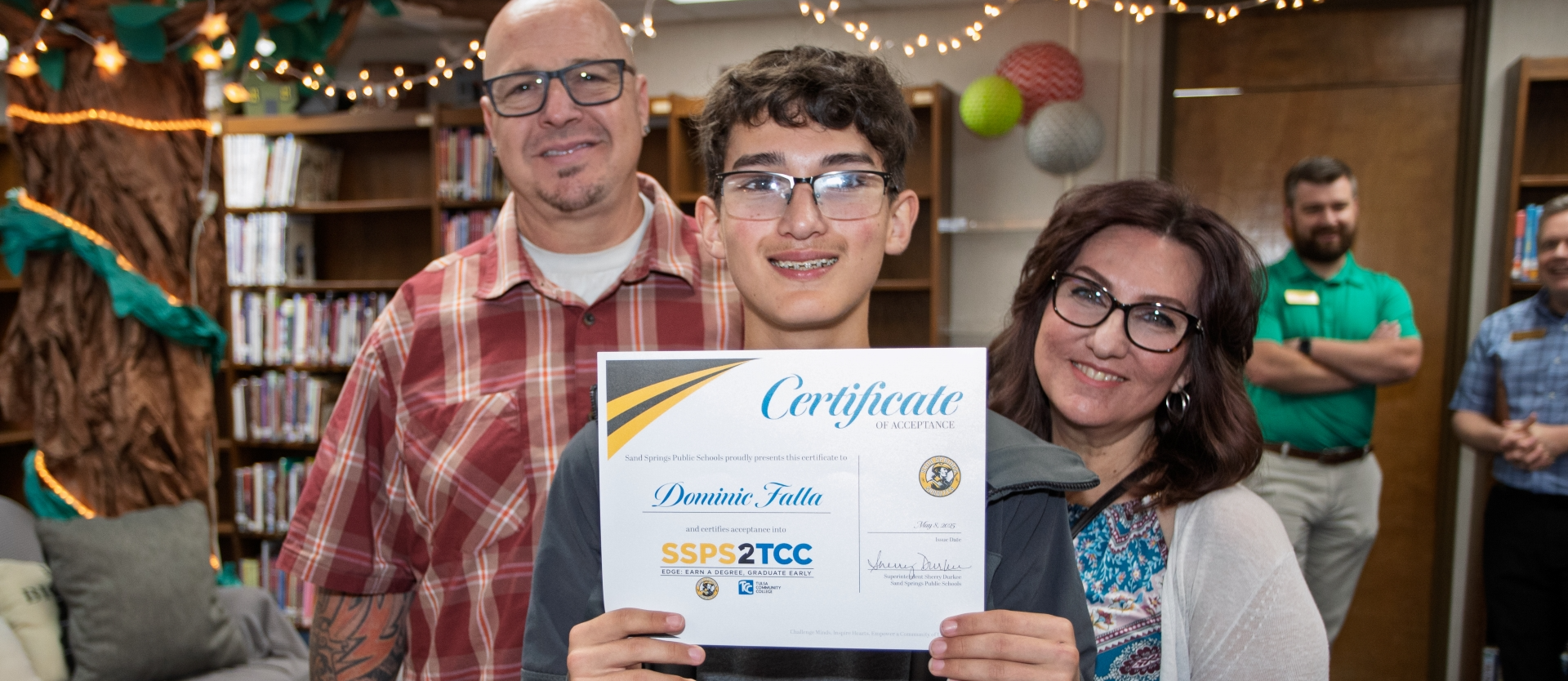 Student holding certificate for TCC EDGE program