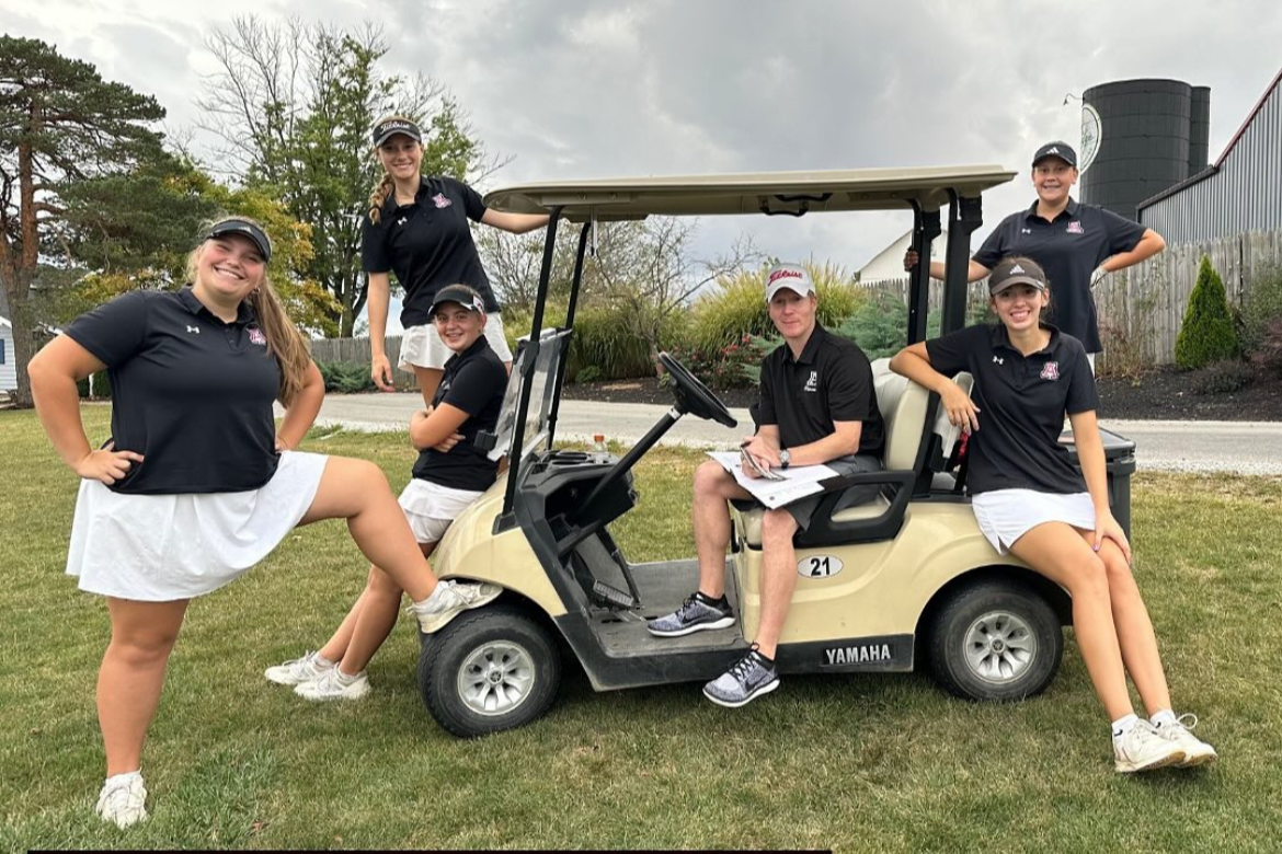 golf coach and golfers