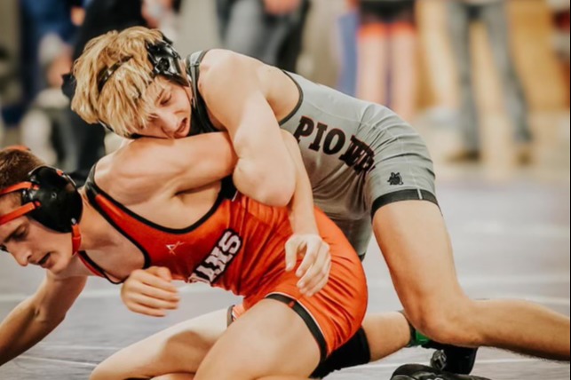 two wrestlers spar